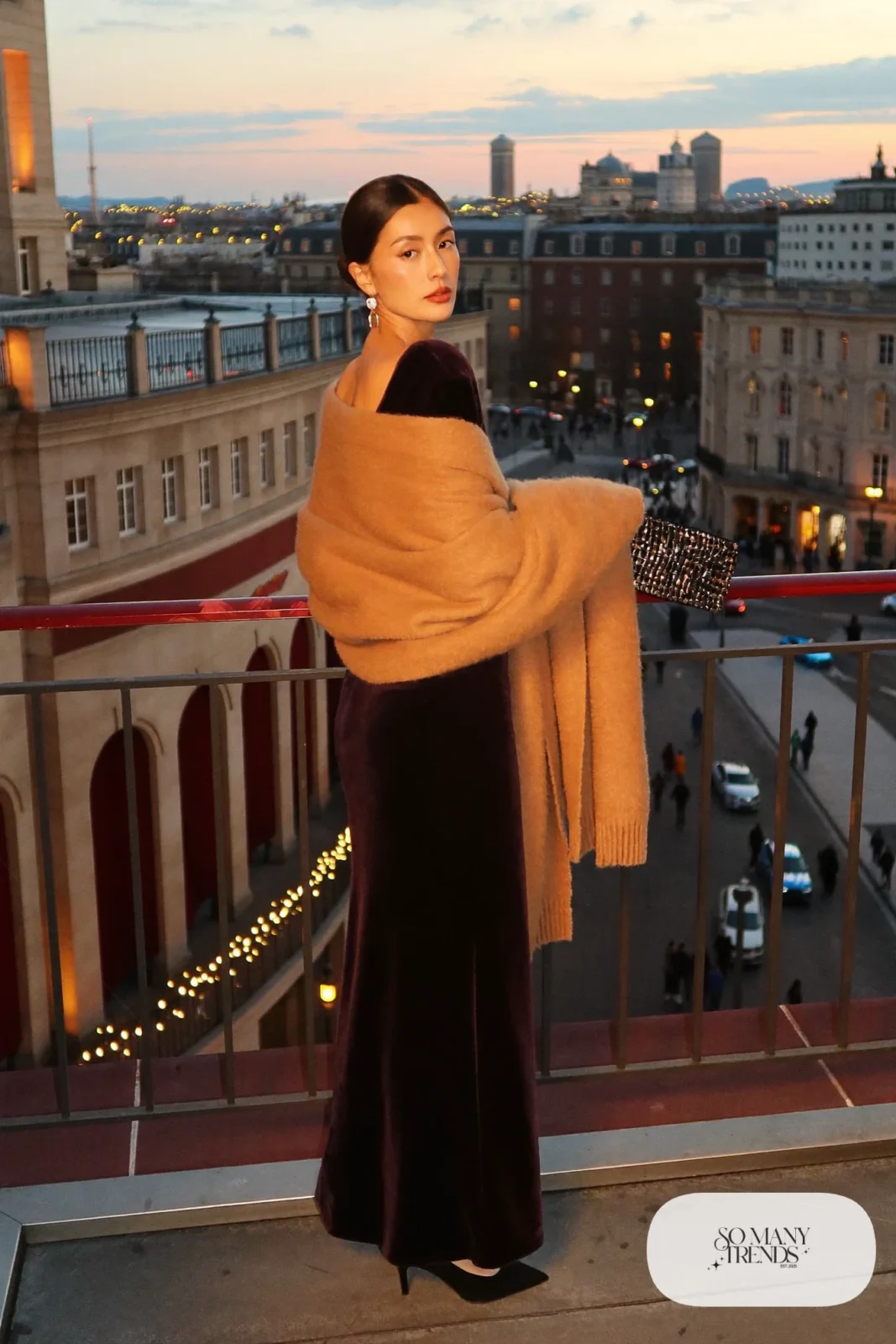 black velvet floor-length gown with large camel cashmere wrap, gold earrings and black heels, formal winter outfit 24