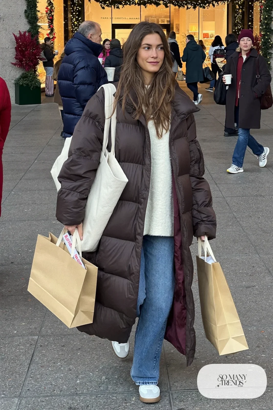 long brown puffer coat barrel jeans cream sweater white leather sneakers tote bag outfit 8