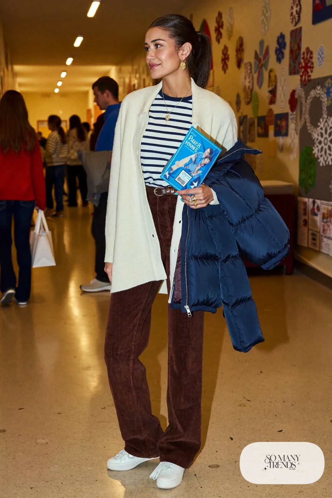 chocolate wide-leg corduroy pants cream cardigan striped tee navy puffer jacket white sneakers outfit 16