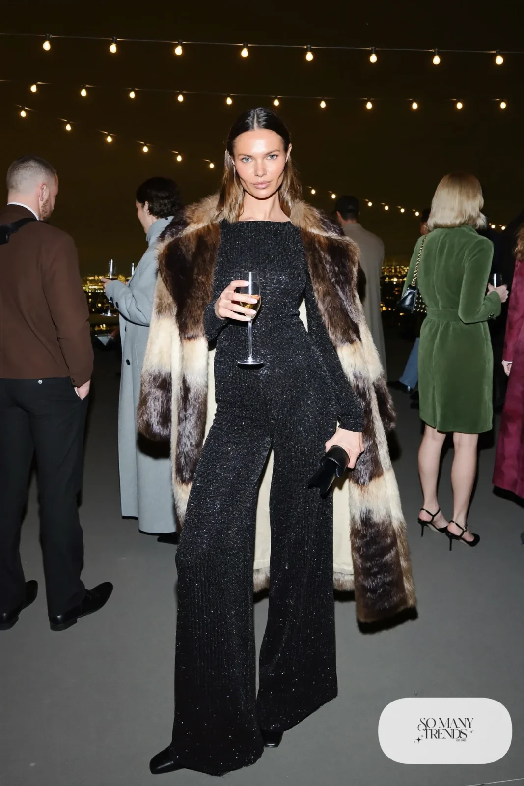 black sequin wide-leg jumpsuit closed-toe heels faux fur coat clutch outfit 29