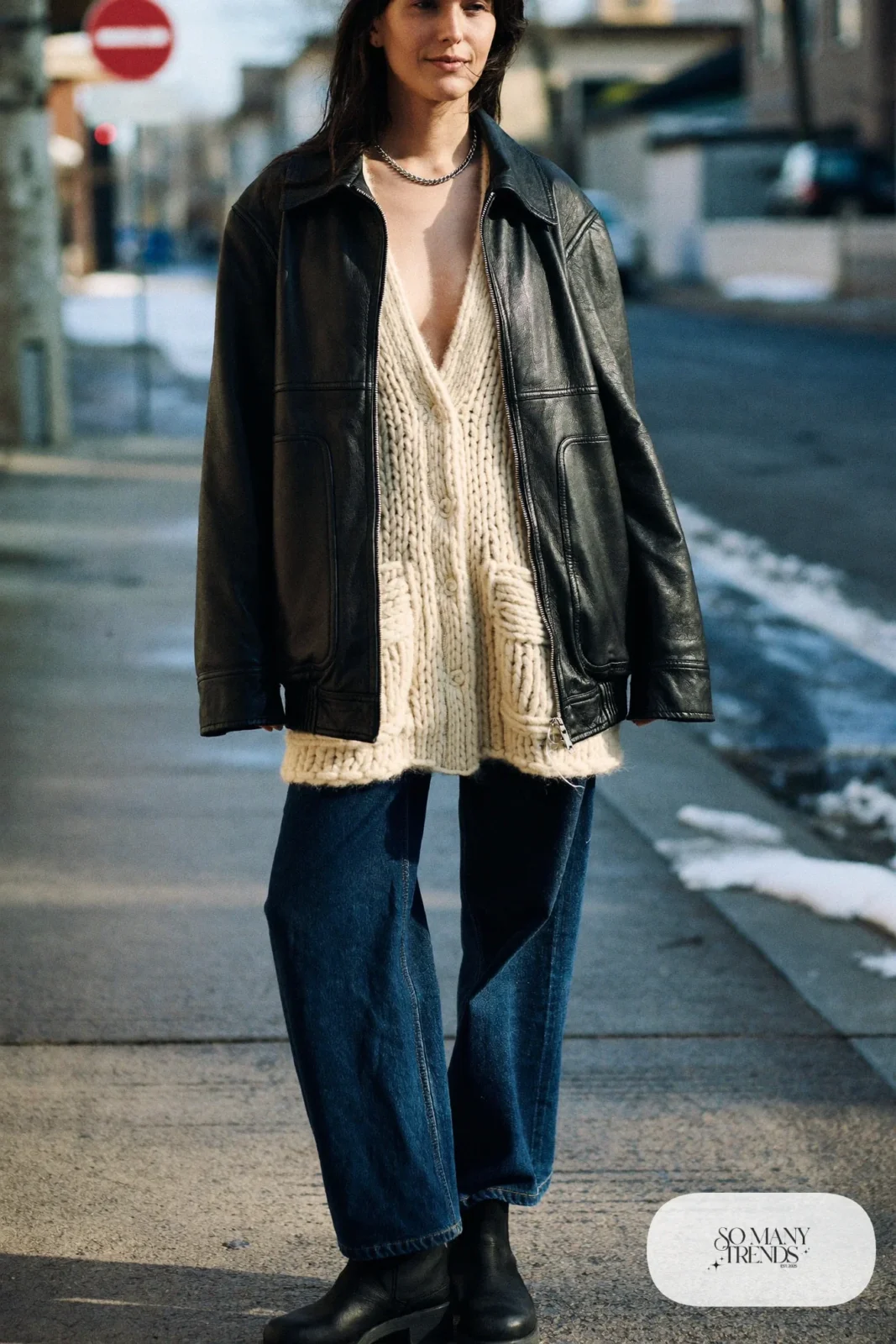 boxy black leather jacket oatmeal chunky cardigan wide-leg jeans black boots silver chain necklace january outfit 14