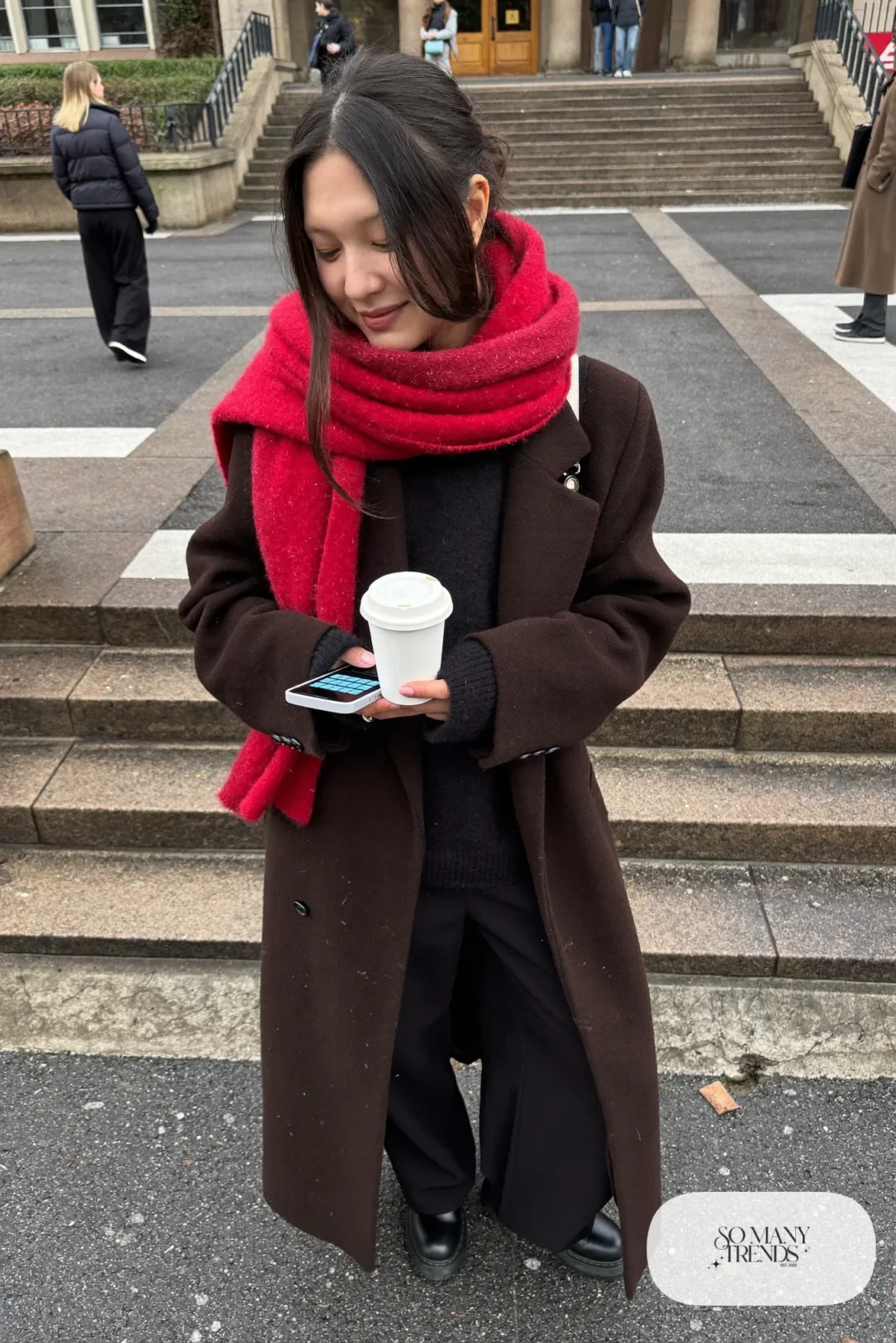 Long black coat, cherry red wool scarf, black sweater, black wide-leg pants, chunky black boots, winter outfit 4