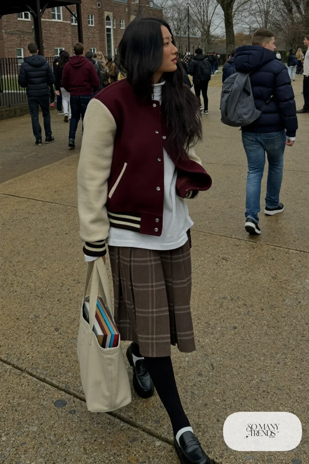 Burgundy and cream varsity jacket, plaid pleated midi skirt, white turtleneck, black tights, loafers, winter outfit 8