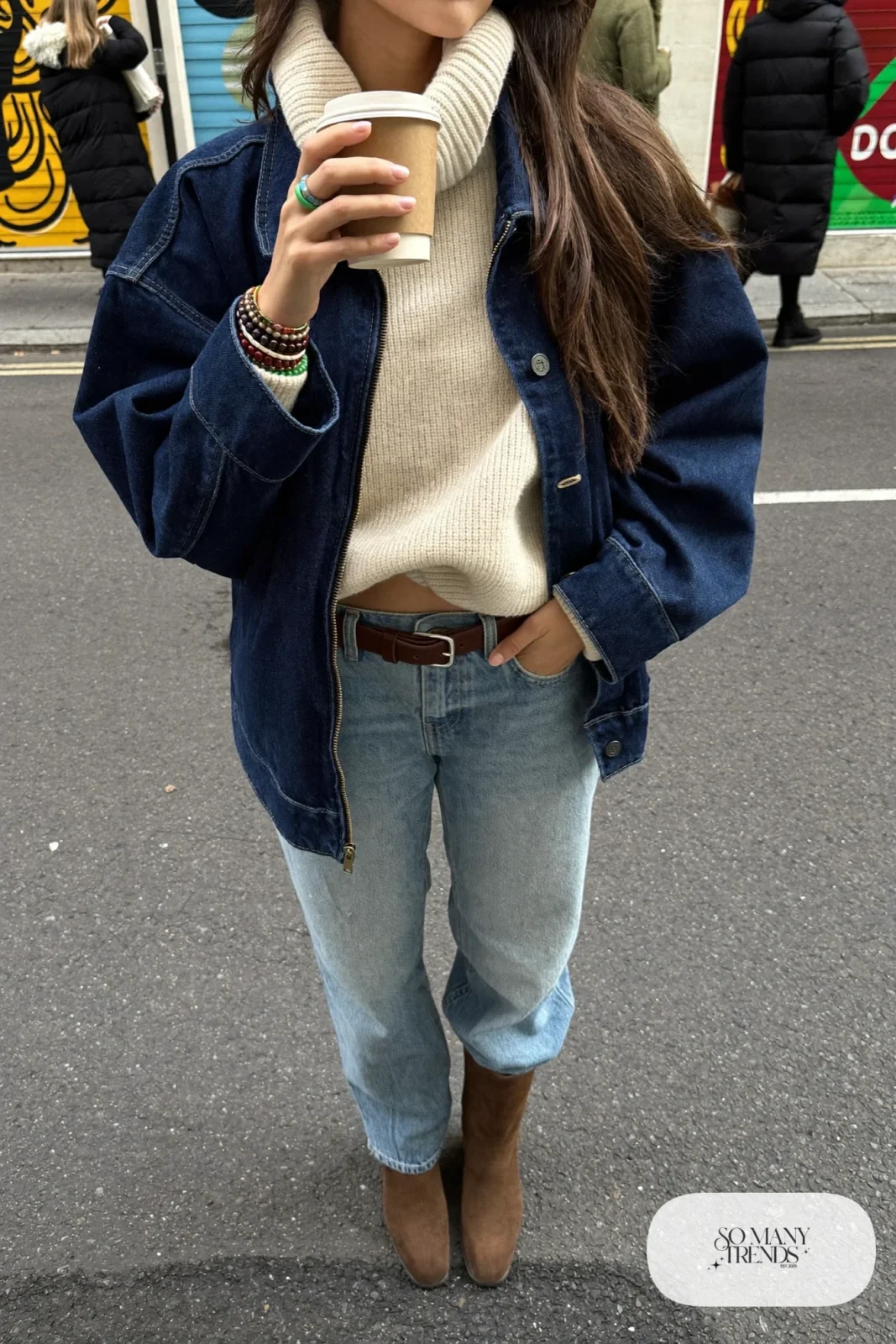 Indigo fleece-lined denim jacket, light wash jeans, cream turtleneck, brown suede boots, leather belt, winter outfit 10