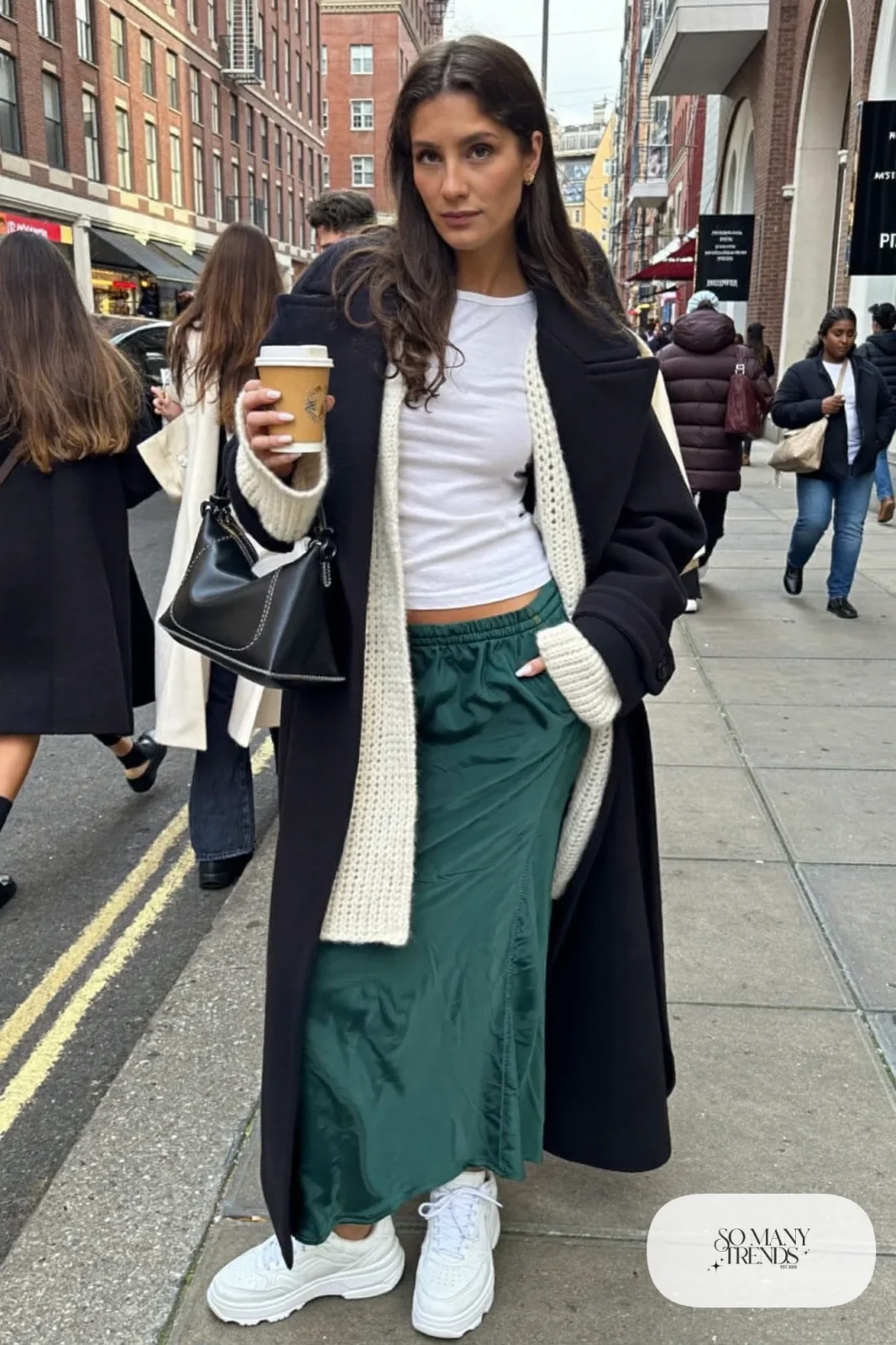 Forest green satin midi skirt, oversized cream cardigan, fitted tee, chunky white sneakers, winter outfit 22