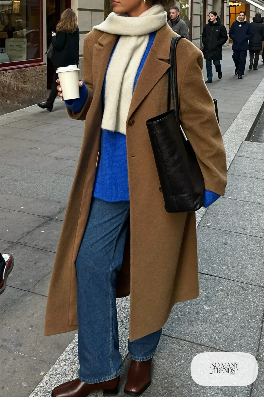 camel oversized wool coat cobalt chunky knit sweater straight leg jeans chocolate leather ankle boots black tote scarf outfit 1