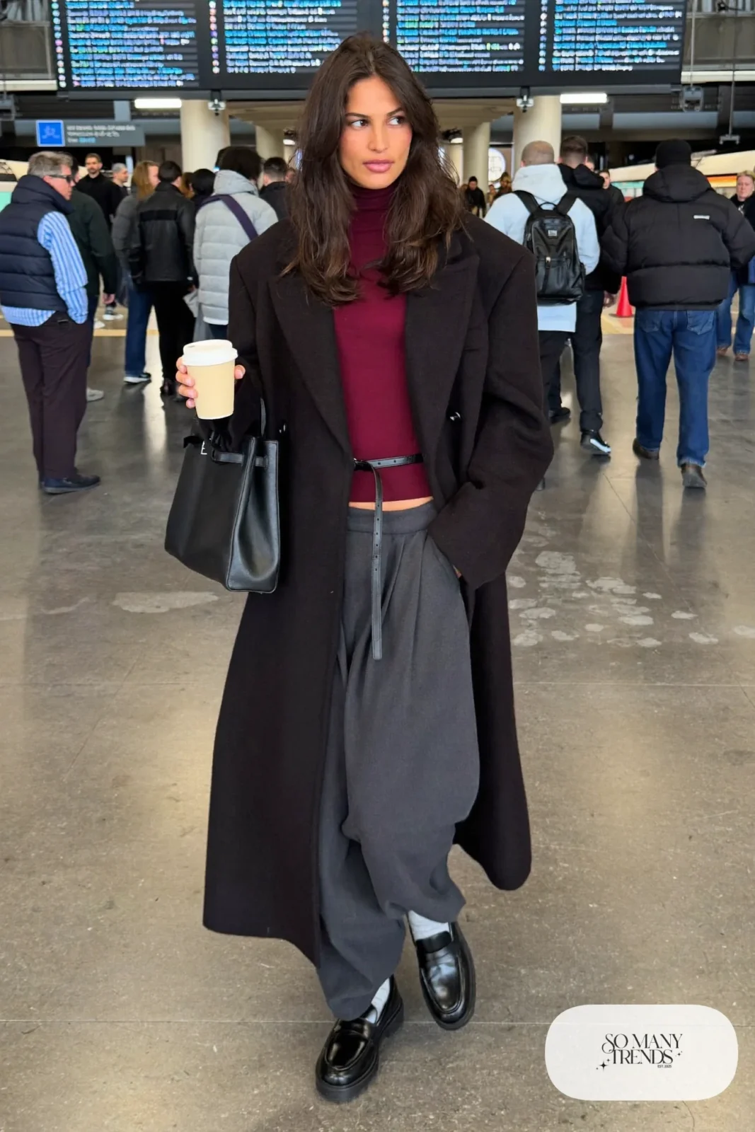 long black wool coat belted burgundy turtleneck charcoal wide leg pants chunky black loafers gray socks leather bag outfit 3