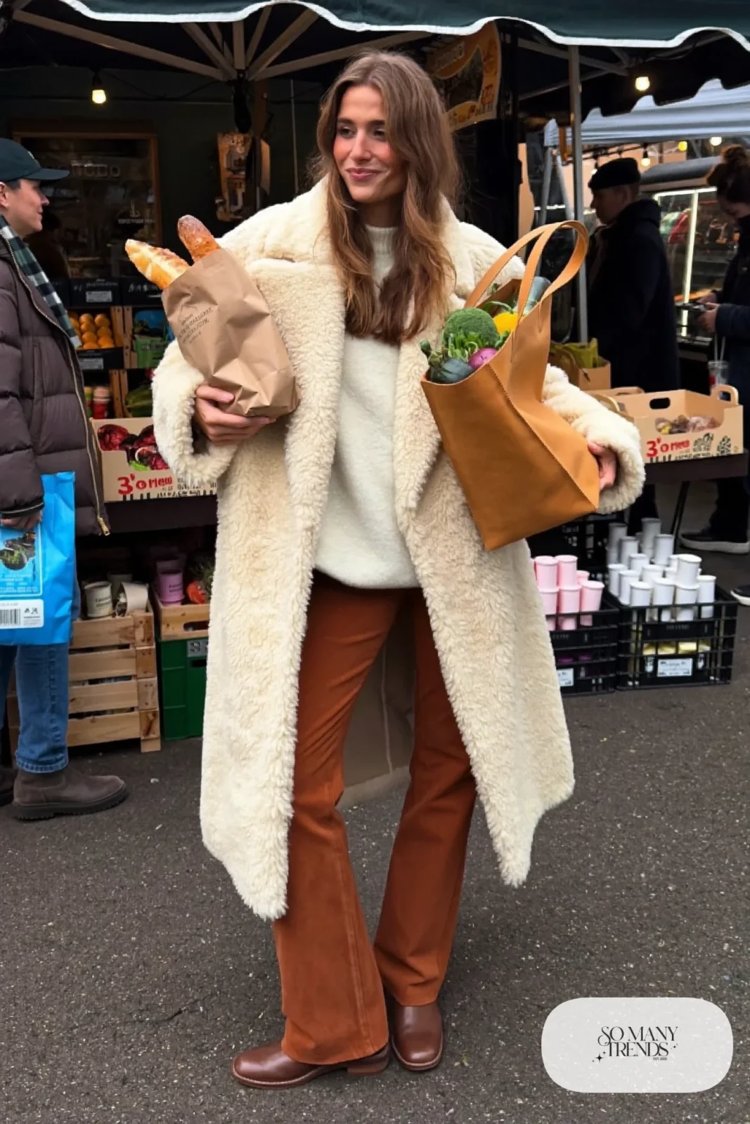 cream oversized teddy coat chocolate brown straight pants white knit sweater brown leather boots tan tote outfit 4