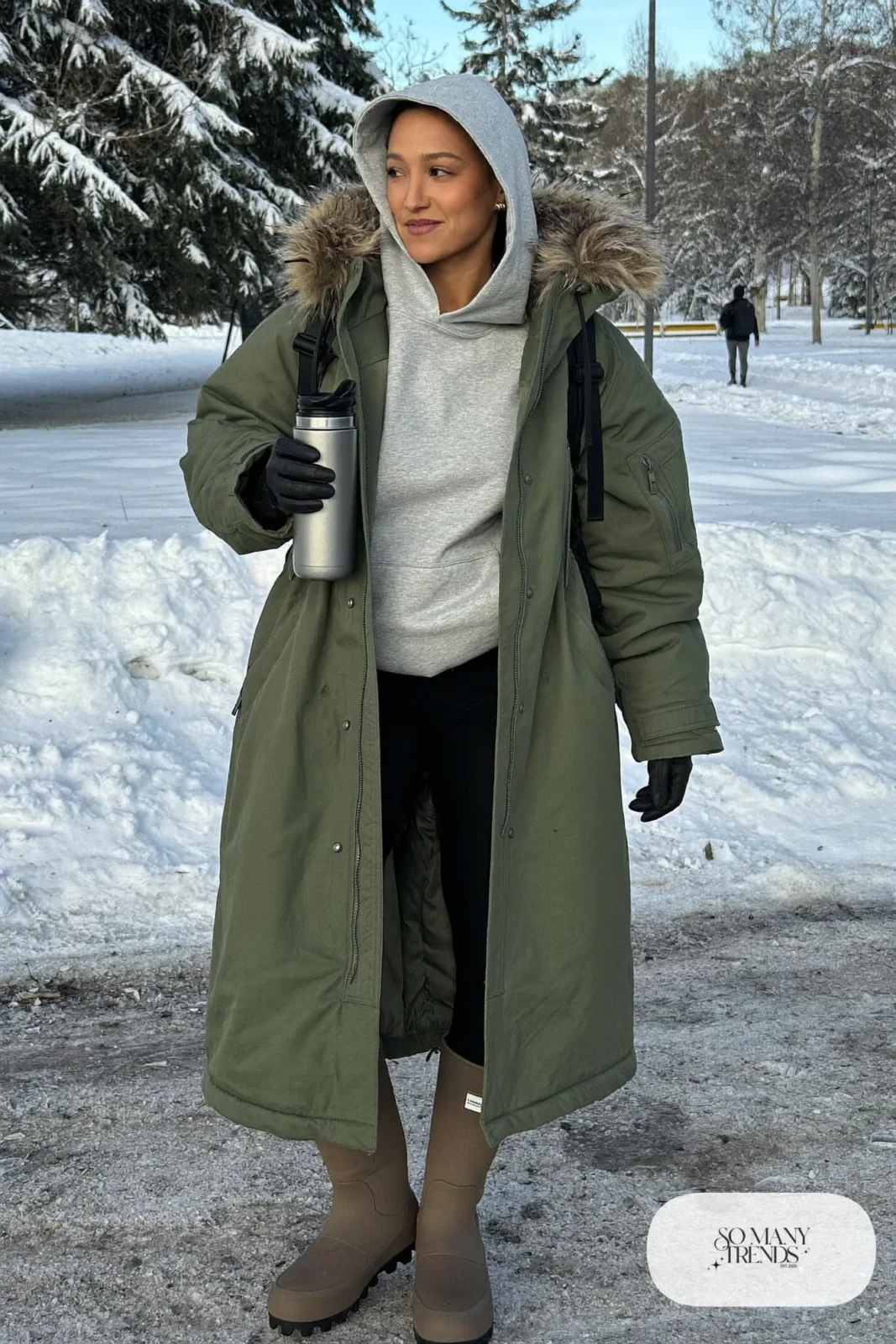 forest green long parka gray hoodie thick black leggings brown waterproof lug sole boots black backpack outfit 7