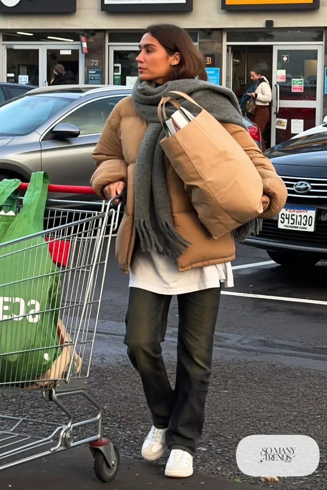 tan quilted boxy jacket white long sleeve tee dark straight jeans white sneakers gray scarf canvas tote outfit 21