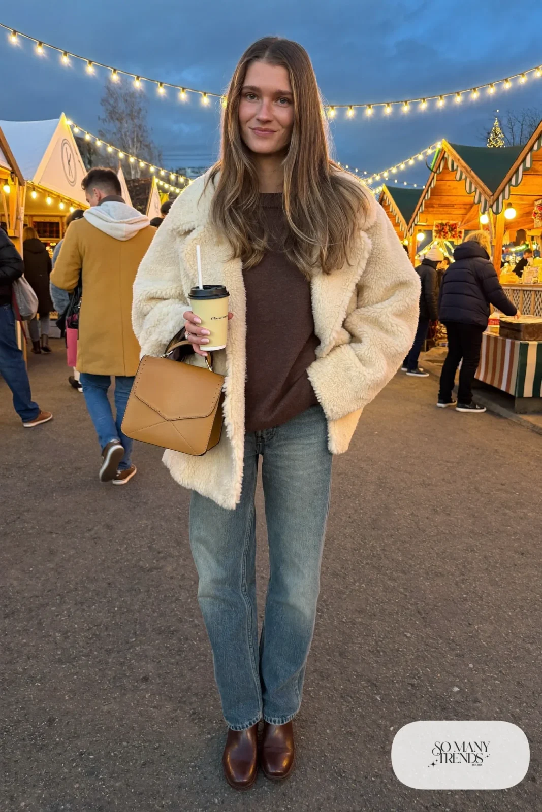 cream oversized shearling coat chocolate brown knit sweater mid wash straight jeans brown leather boots tan bag outfit 27