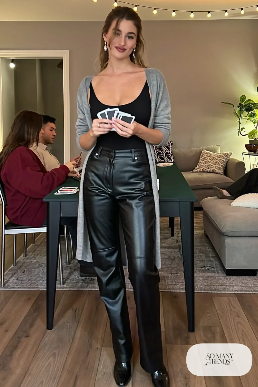 black faux leather straight pants black long-sleeve bodysuit long gray cardigan black boots outfit 18