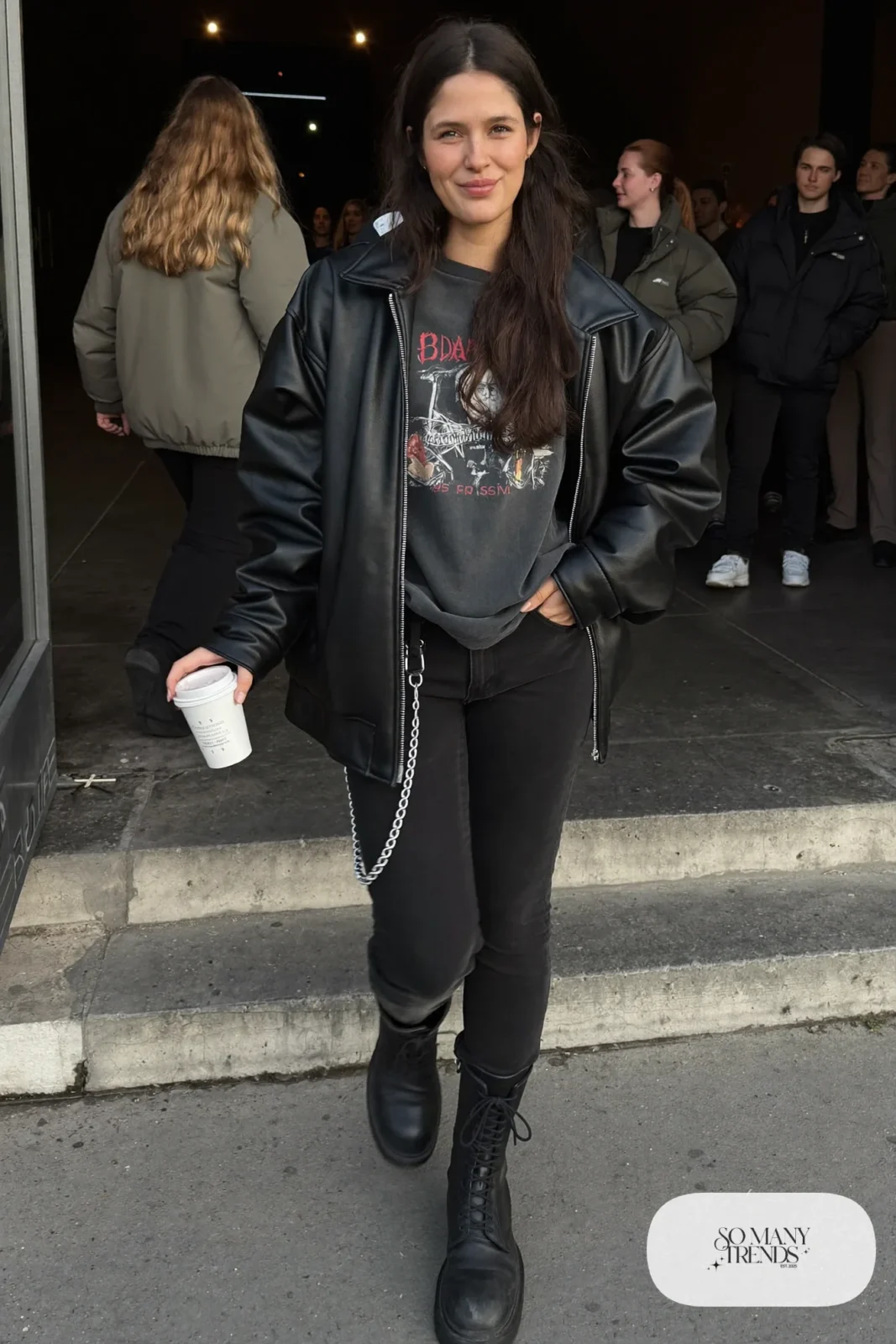 oversized black leather jacket vintage band tee slim black jeans lace-up boots outfit 1