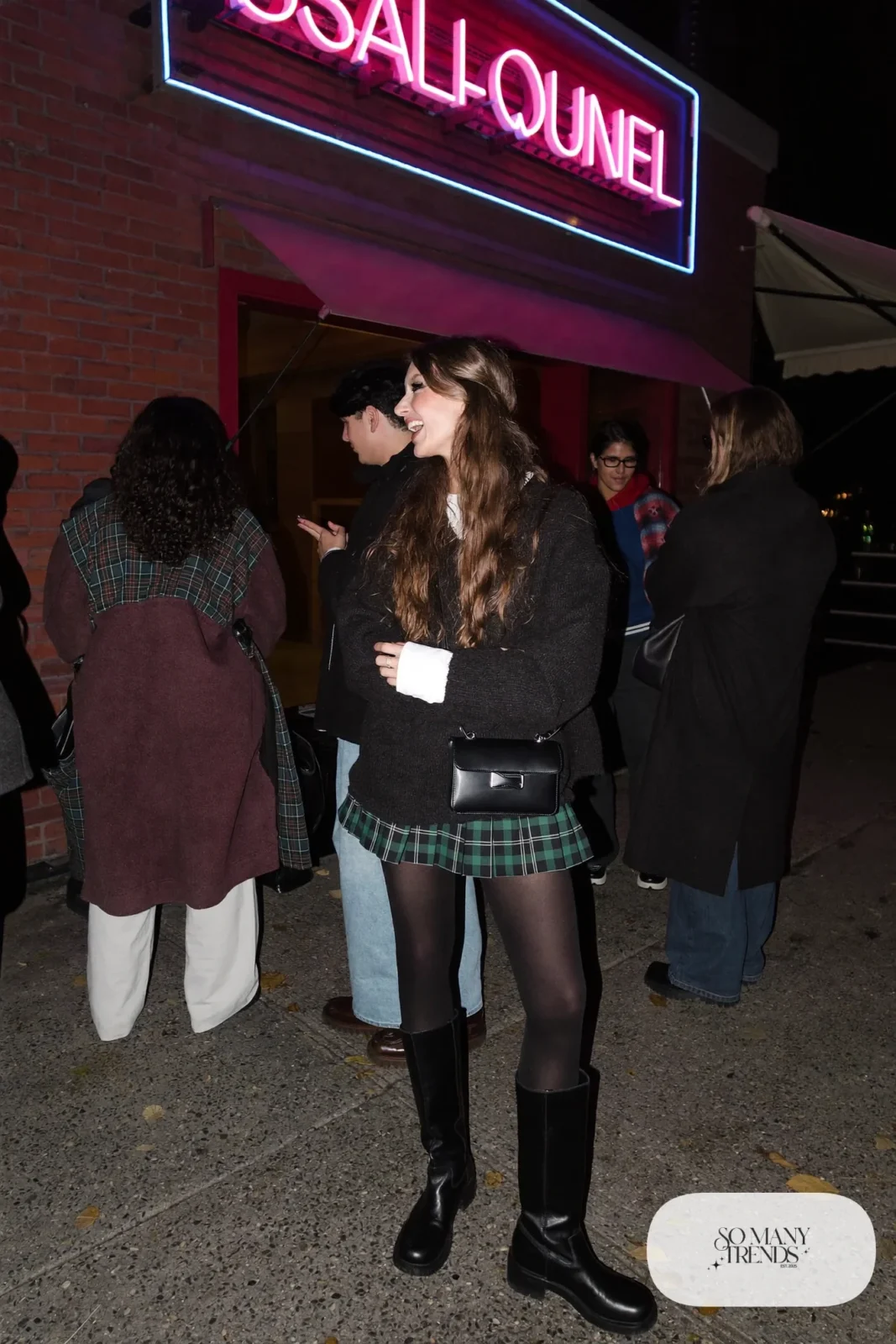 green plaid pleated mini skirt oversized black sweater fleece-lined black tights knee-high boots outfit 4