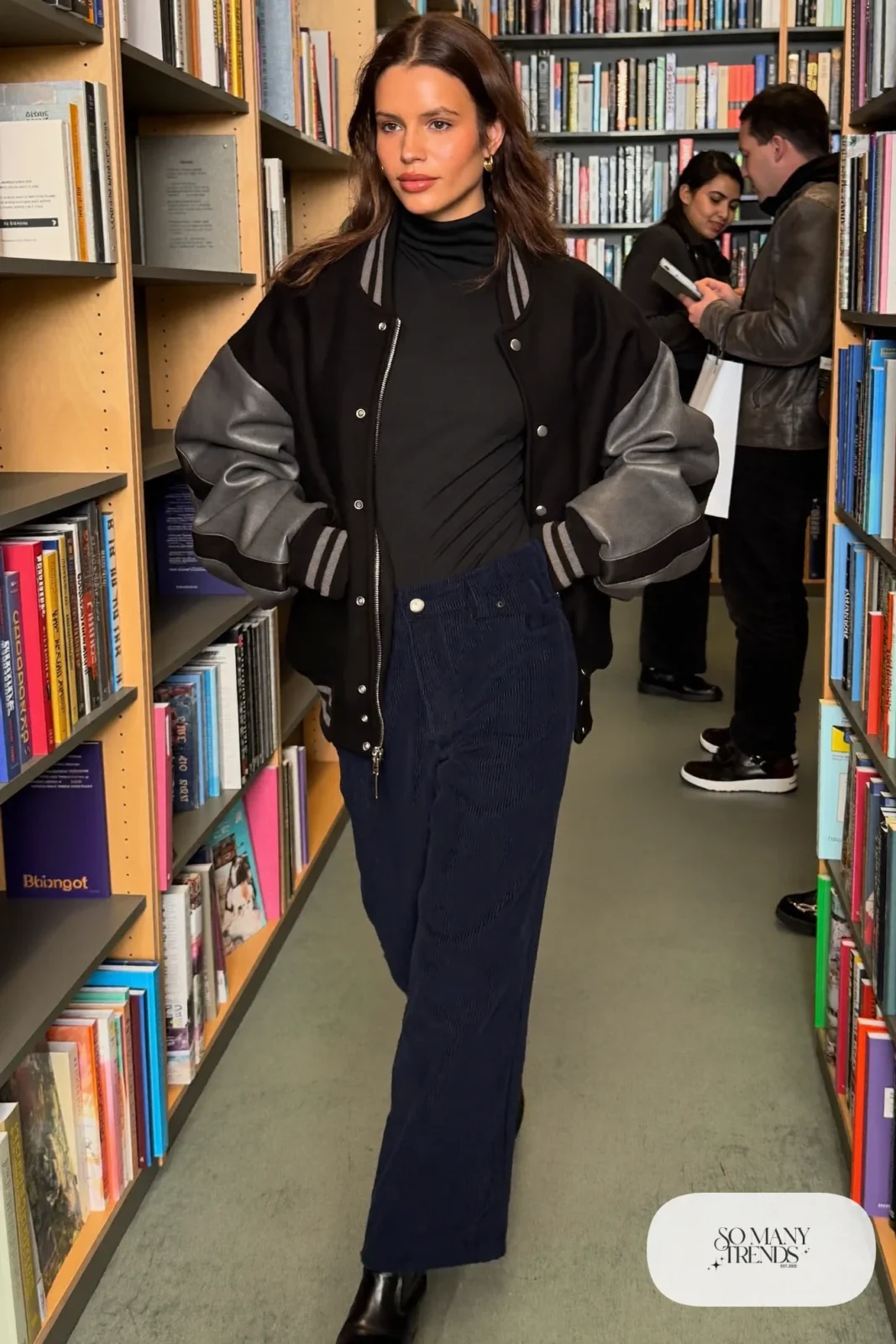 wide-leg navy corduroy pants black turtleneck varsity jacket black boots outfit 17