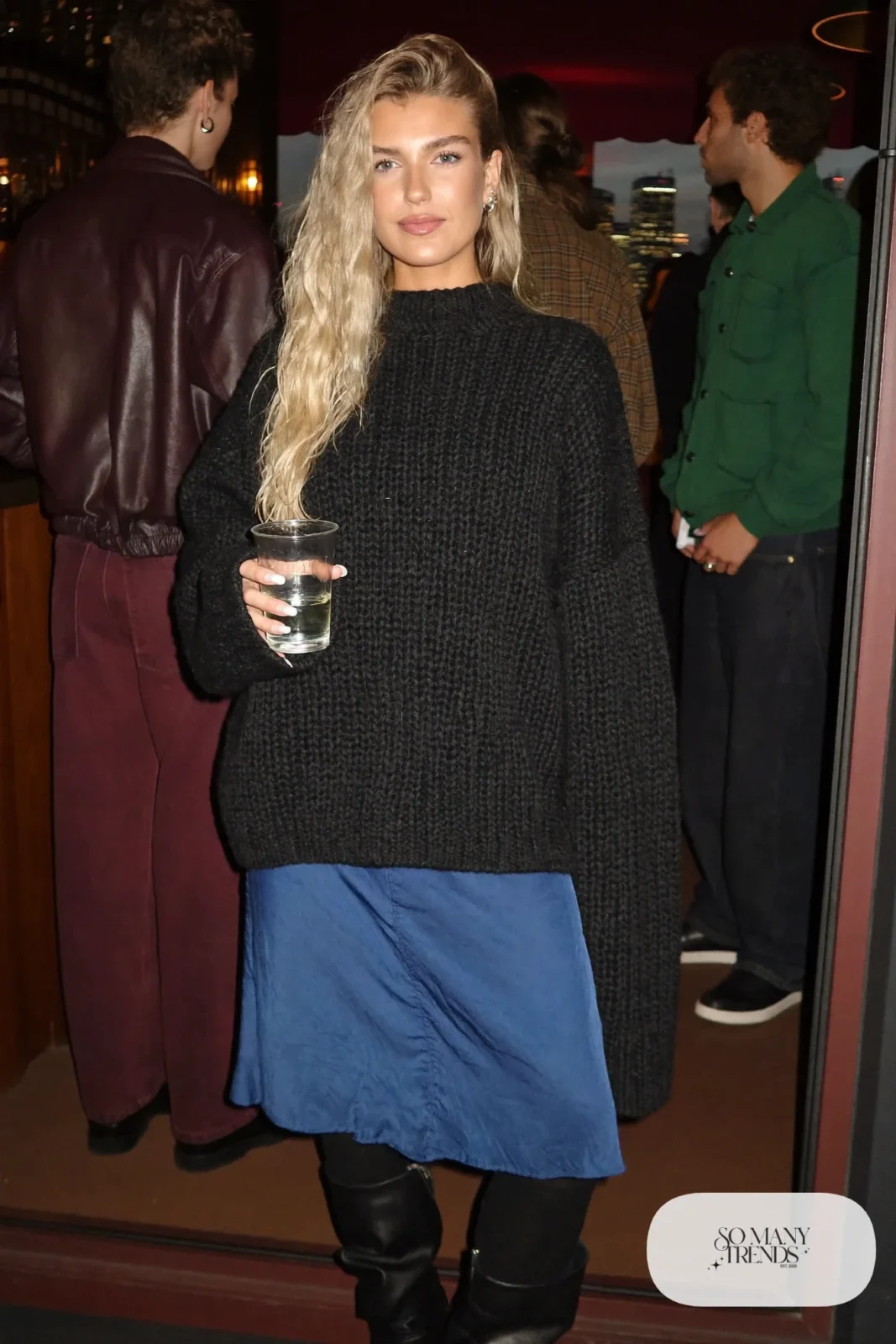 cobalt blue satin midi slip skirt chunky black knit sweater black tights slouchy boots outfit 21