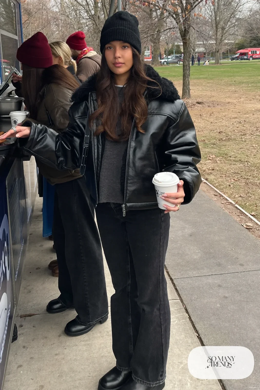 black faux shearling boxy jacket gray sweater dark straight jeans chunky boots beanie outfit 22