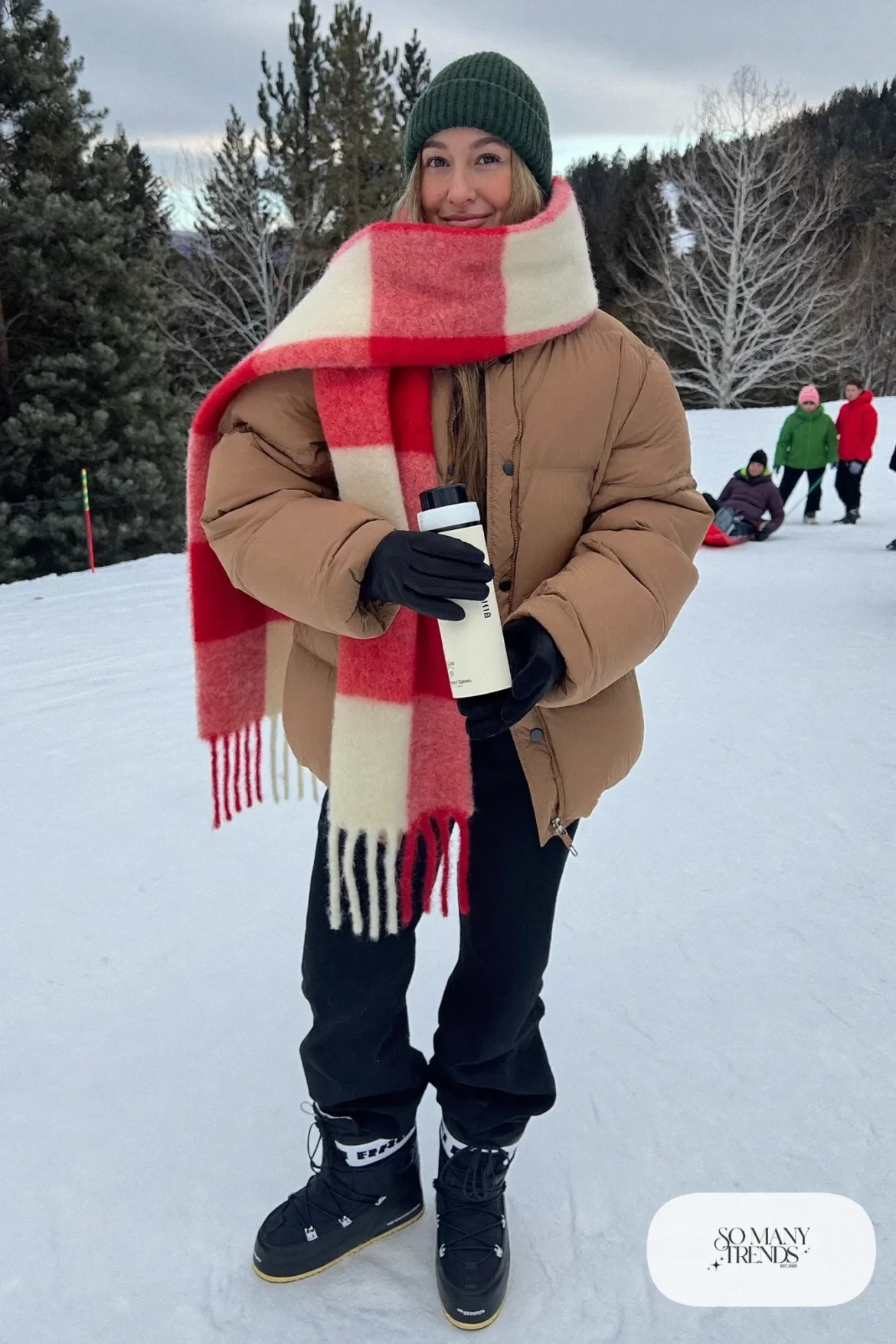 camel puffer jacket red plaid wool scarf black ski pants long-cuff waterproof gloves snow boots outfit 12