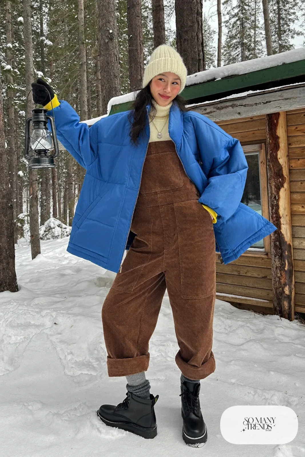 cobalt blue quilted jacket brown corduroy overalls thermal turtleneck thick socks waterproof boots beanie outfit 17