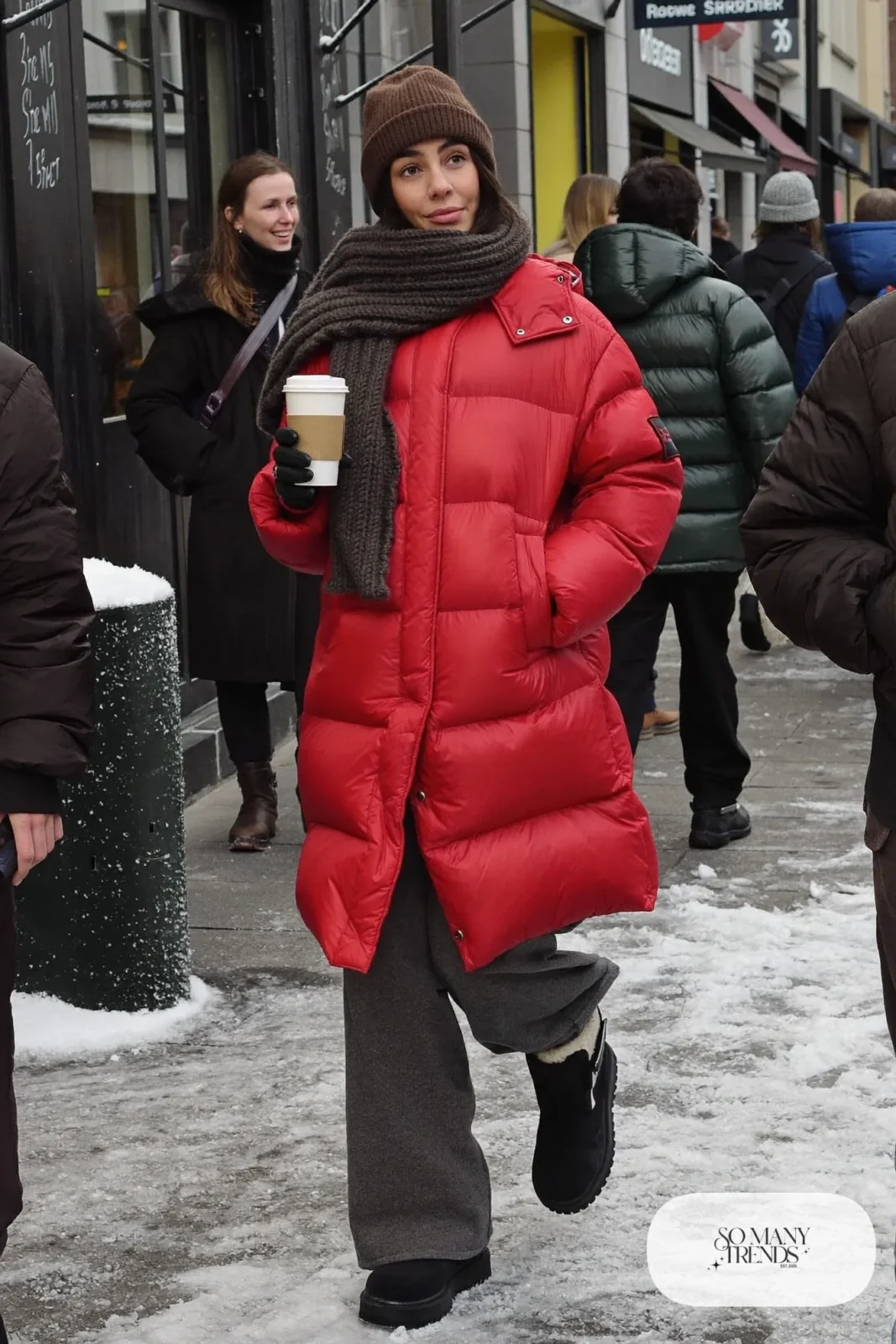 cherry red long puffer coat gray wide-leg wool pants charcoal scarf black lug-sole boots outfit 1