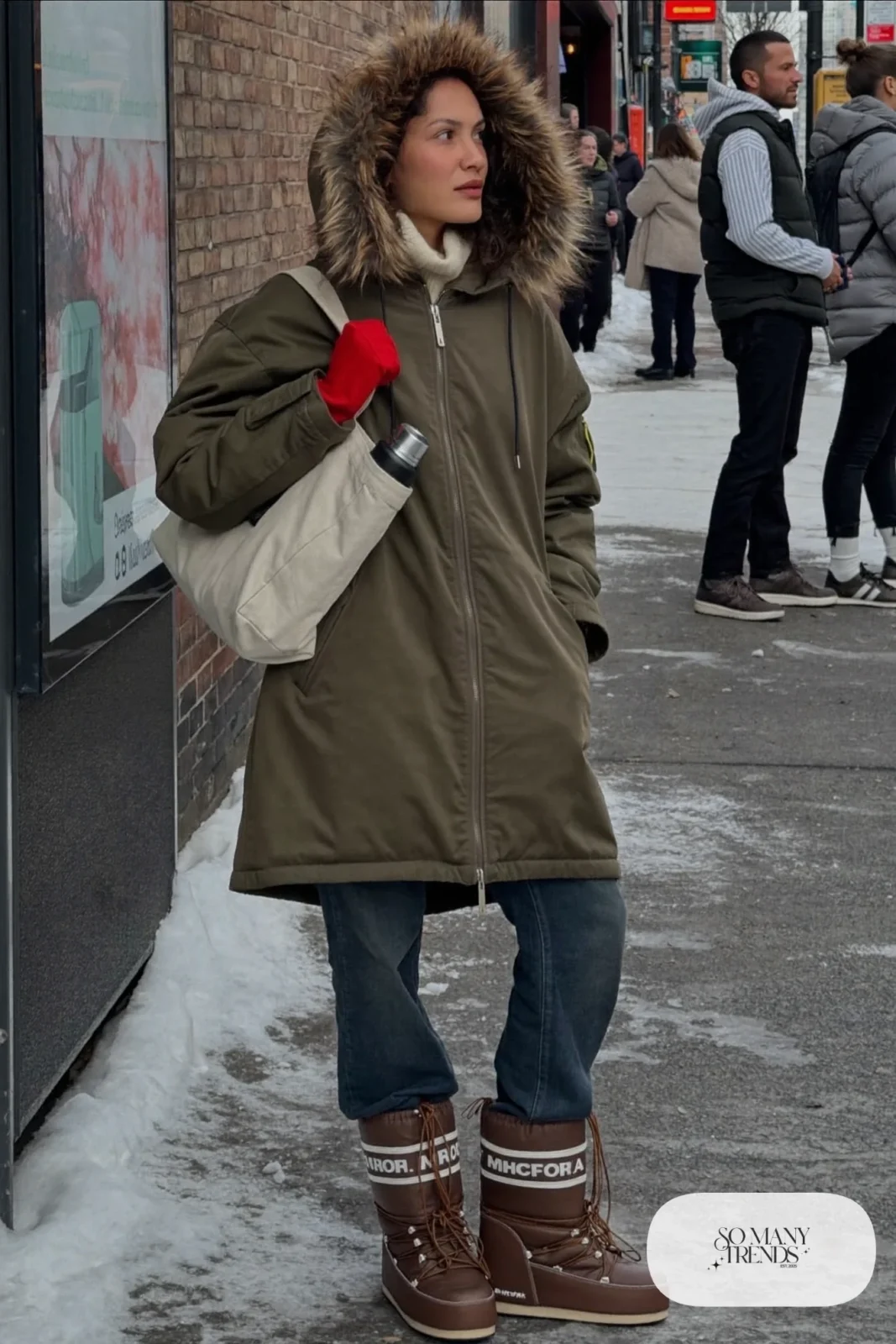 olive green parka faux fur hood cream ribbed turtleneck dark straight jeans snow boots tote bag outfit 2