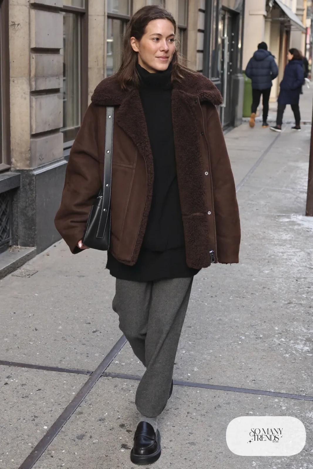 chocolate brown shearling-lined jacket black turtleneck gray wool pants lug-sole loafers wool socks outfit 6