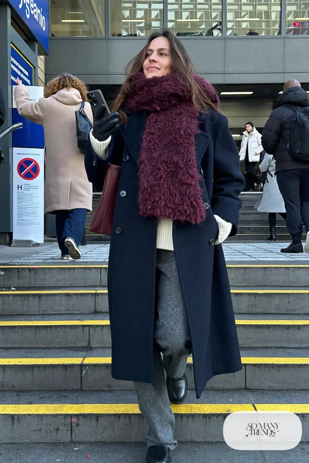 navy double-breasted wool coat burgundy scarf cream sweater gray wool pants black leather boots outfit 9