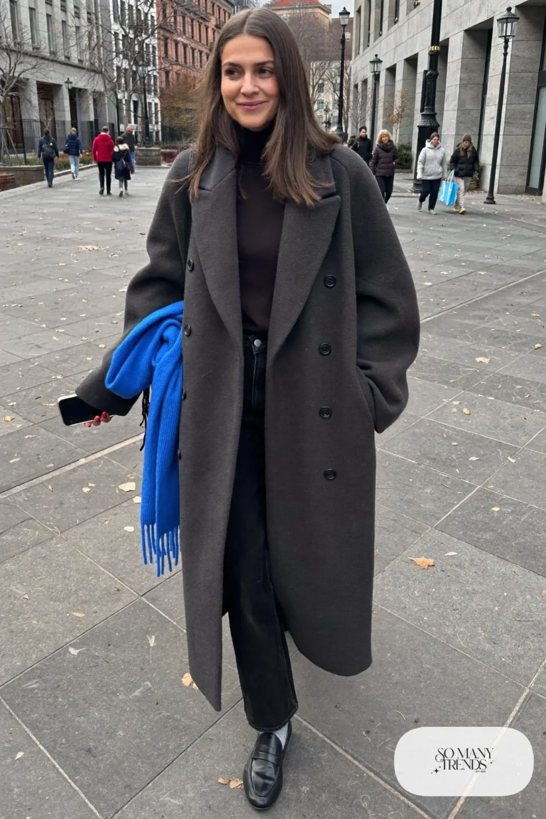 long charcoal wool coat cobalt blue scarf black turtleneck straight black pants loafers outfit 4