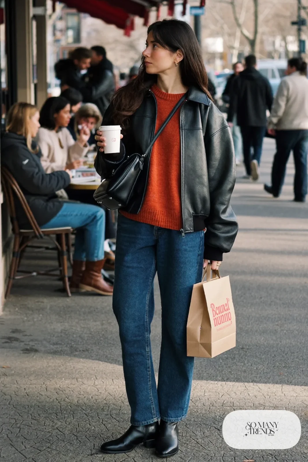 boxy black leather jacket slouchy rust sweater dark straight jeans black ankle boots crossbody outfit 21