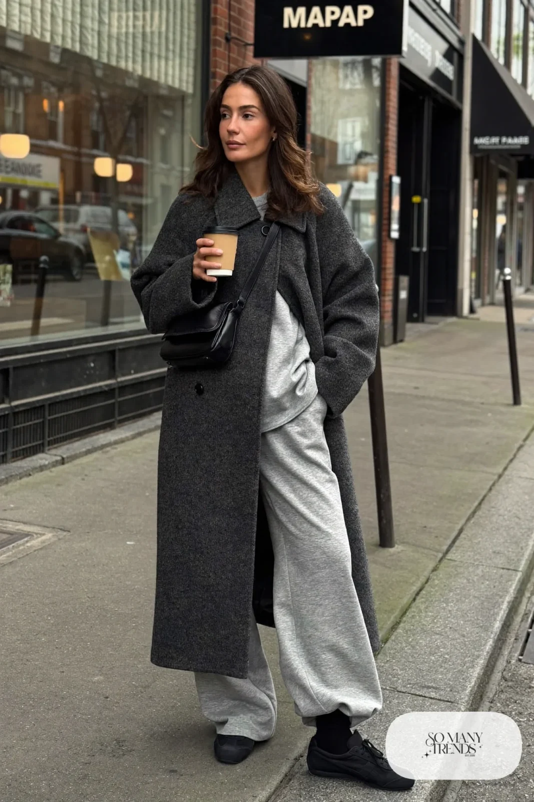 long charcoal wool coat gray sweatshirt matching sweatpants black sneakers crossbody bag outfit 4