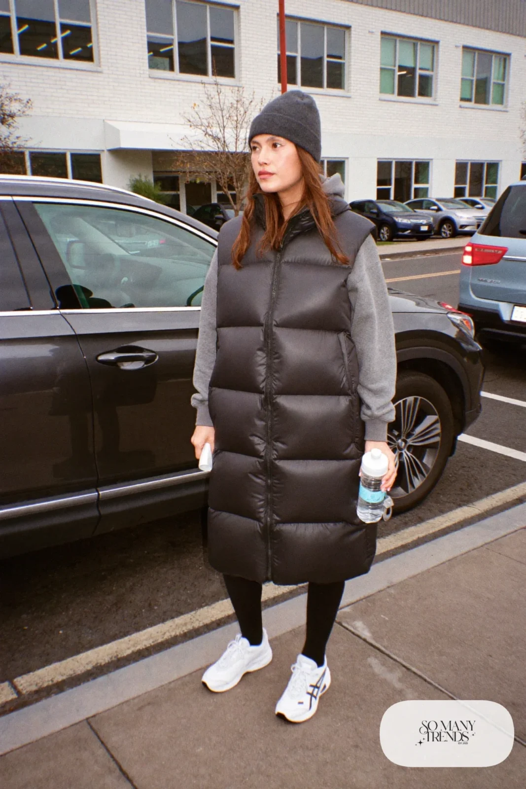 black boxy puffer vest gray hoodie black brushed leggings beanie white sneakers outfit 8