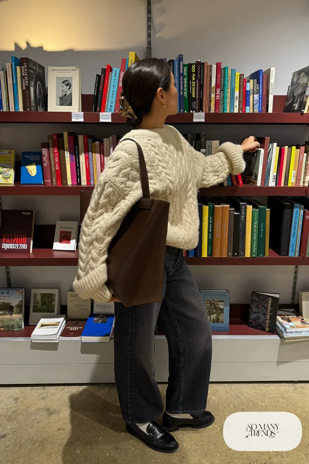 cream cable-knit sweater dark wide-leg jeans black loafers leather tote outfit 9
