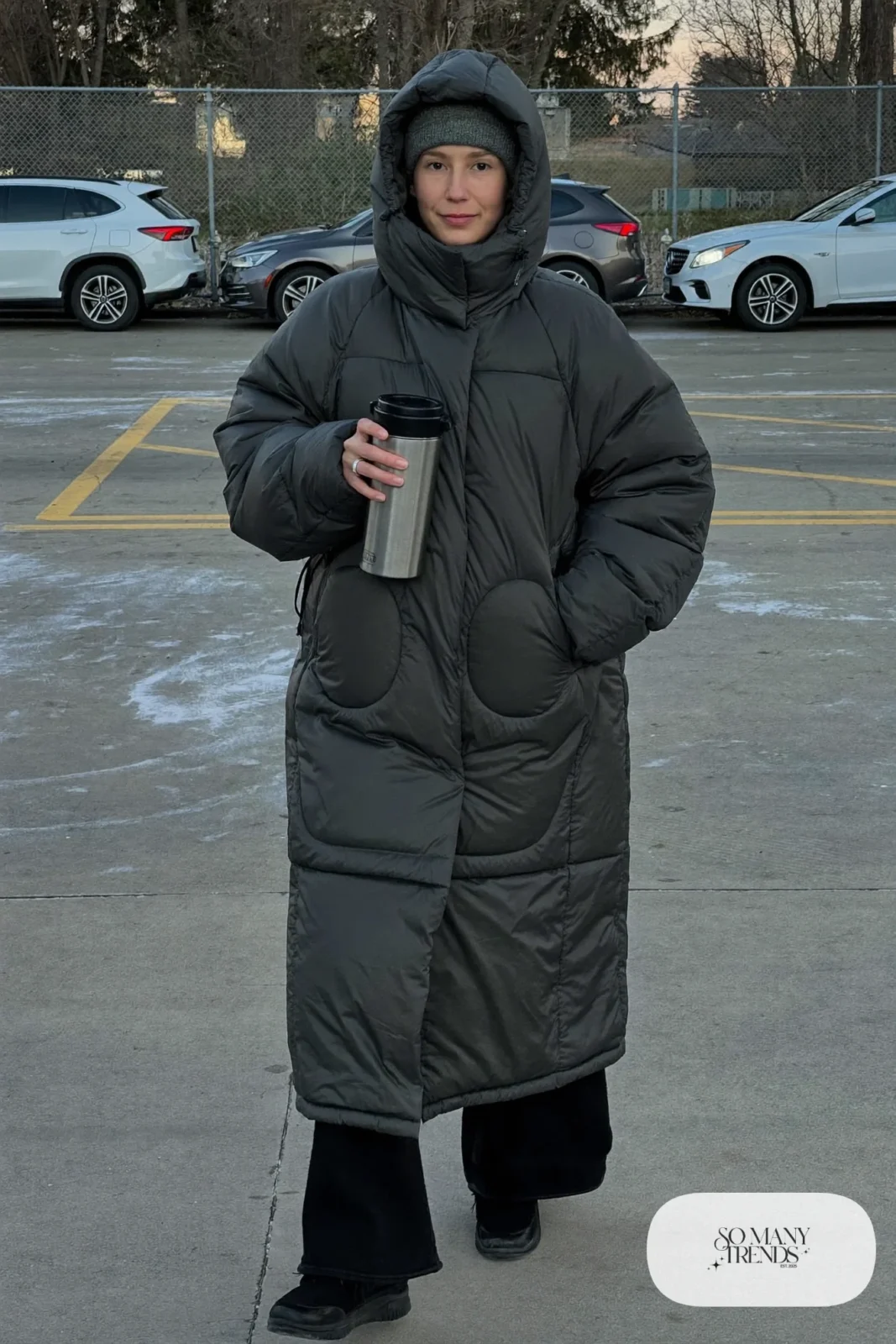 long charcoal quilted hooded coat black wide sweatpants black sneakers beanie outfit 23