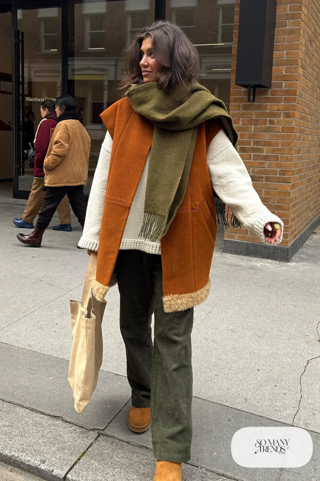 camel shearling vest cream crochet sweater olive scarf straight corduroy pants suede boots outfit 2