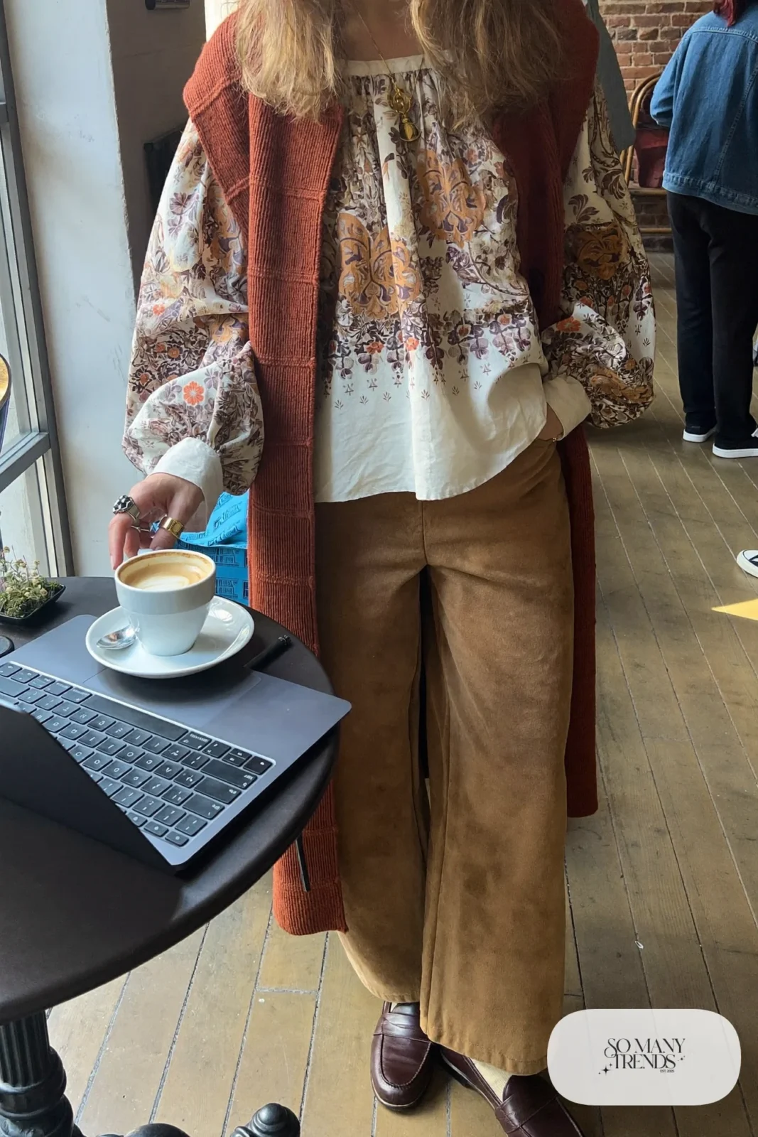 burgundy knit vest cream floral blouse wide-leg camel pants loafers layered necklaces outfit 11