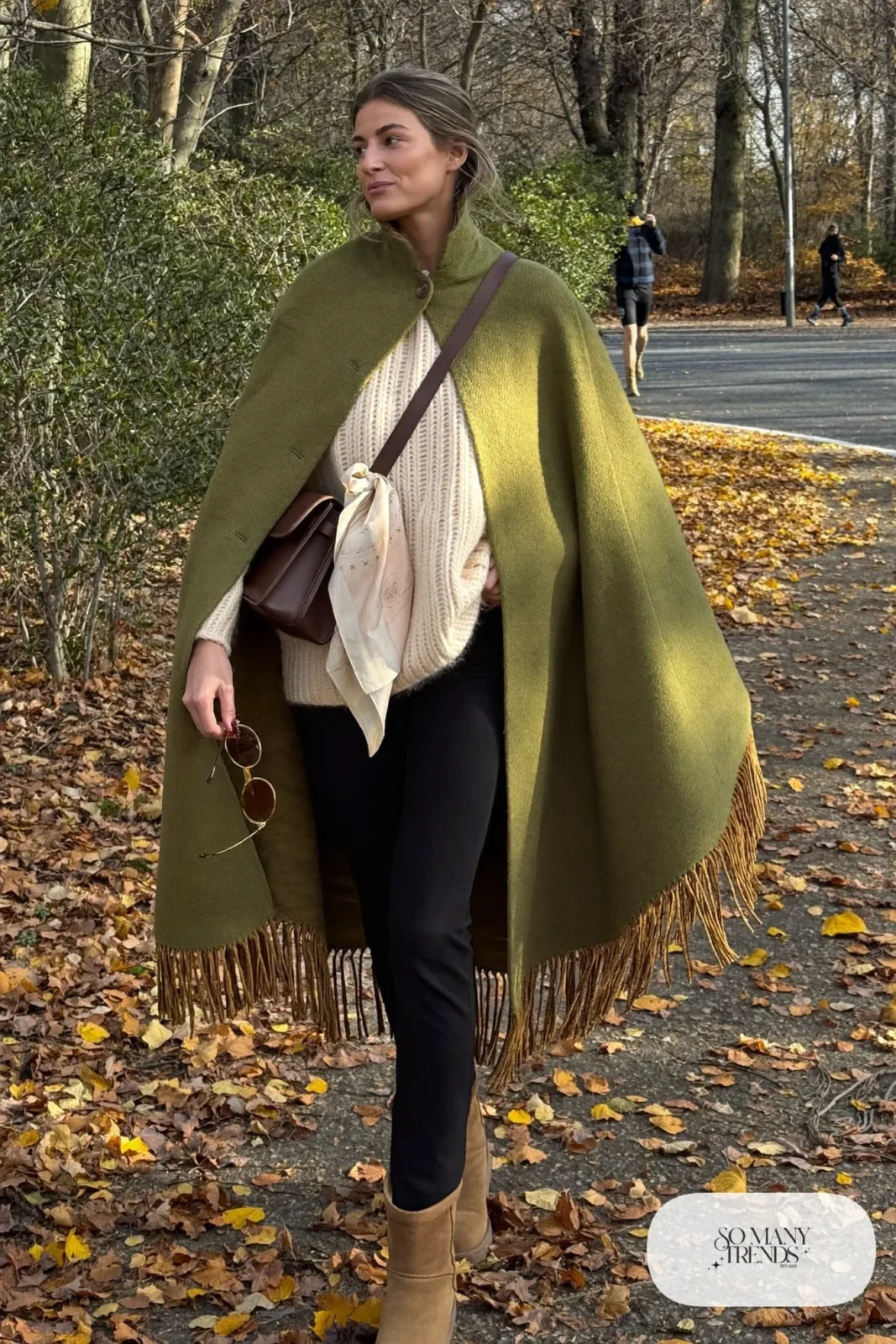 olive wool fringe cape black skinny jeans tan ankle boots cream sweater crossbody bag outfit 19