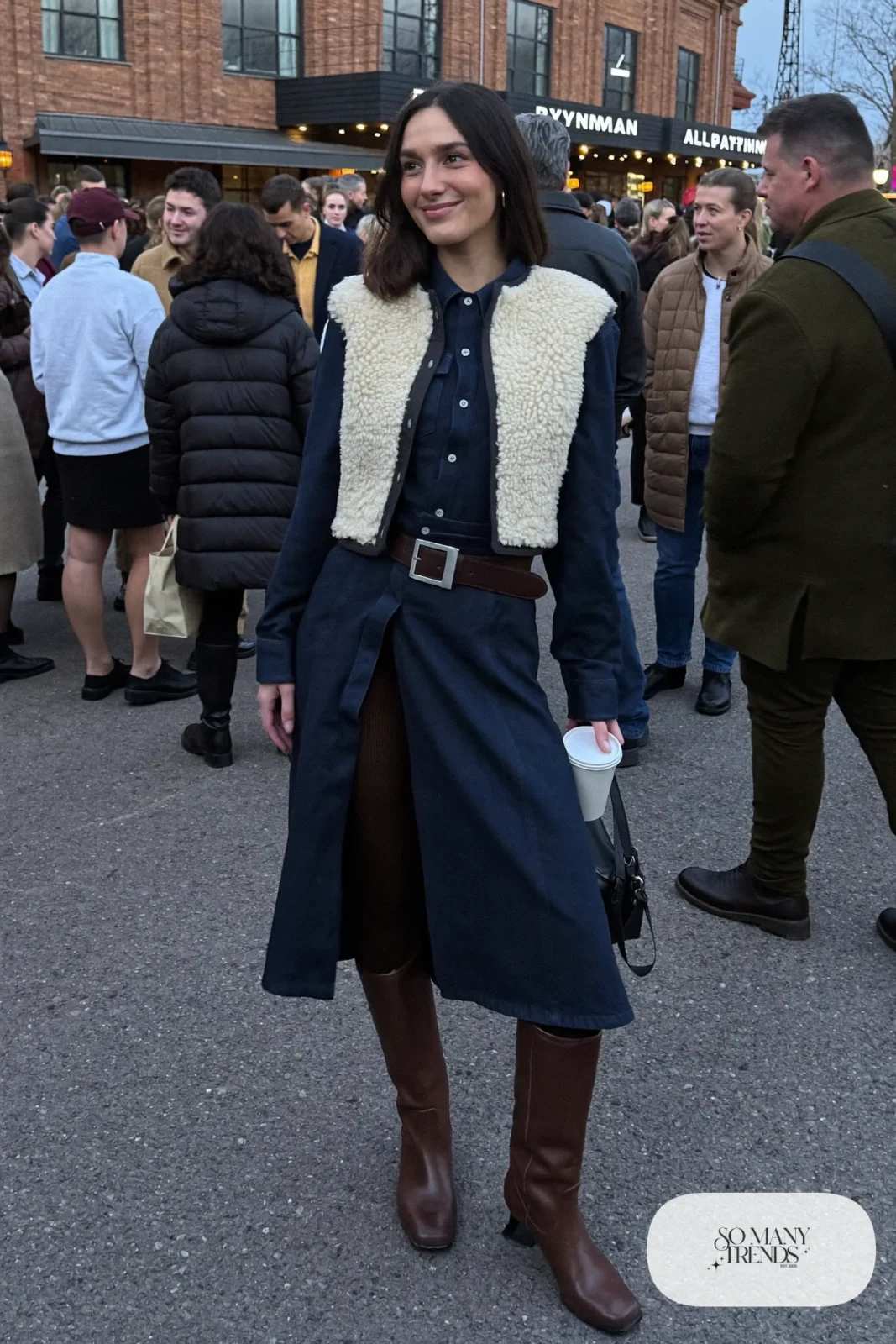 navy snap front western midi dress shearling vest black tights tall brown boots statement belt nashville outfit 30