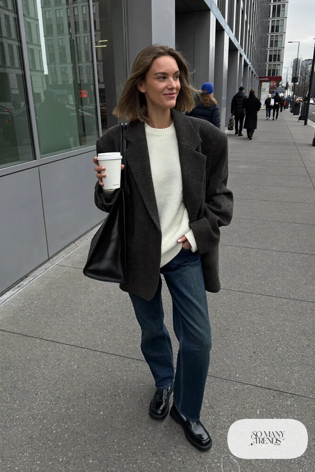 oversized charcoal wool blazer, ivory knit sweater, dark straight jeans, black lug-sole loafers, gray socks, black tote outfit 1