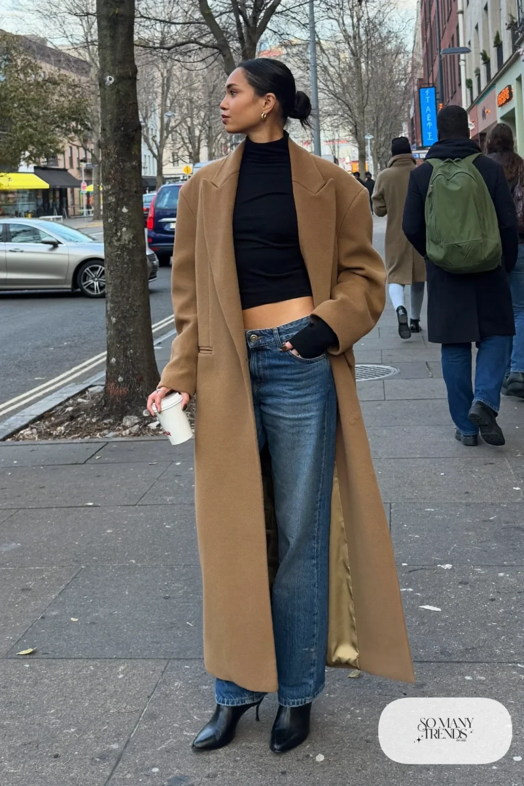 long camel wool coat, black turtleneck, mid-wash straight jeans, black leather ankle boots, gold hoops outfit 2
