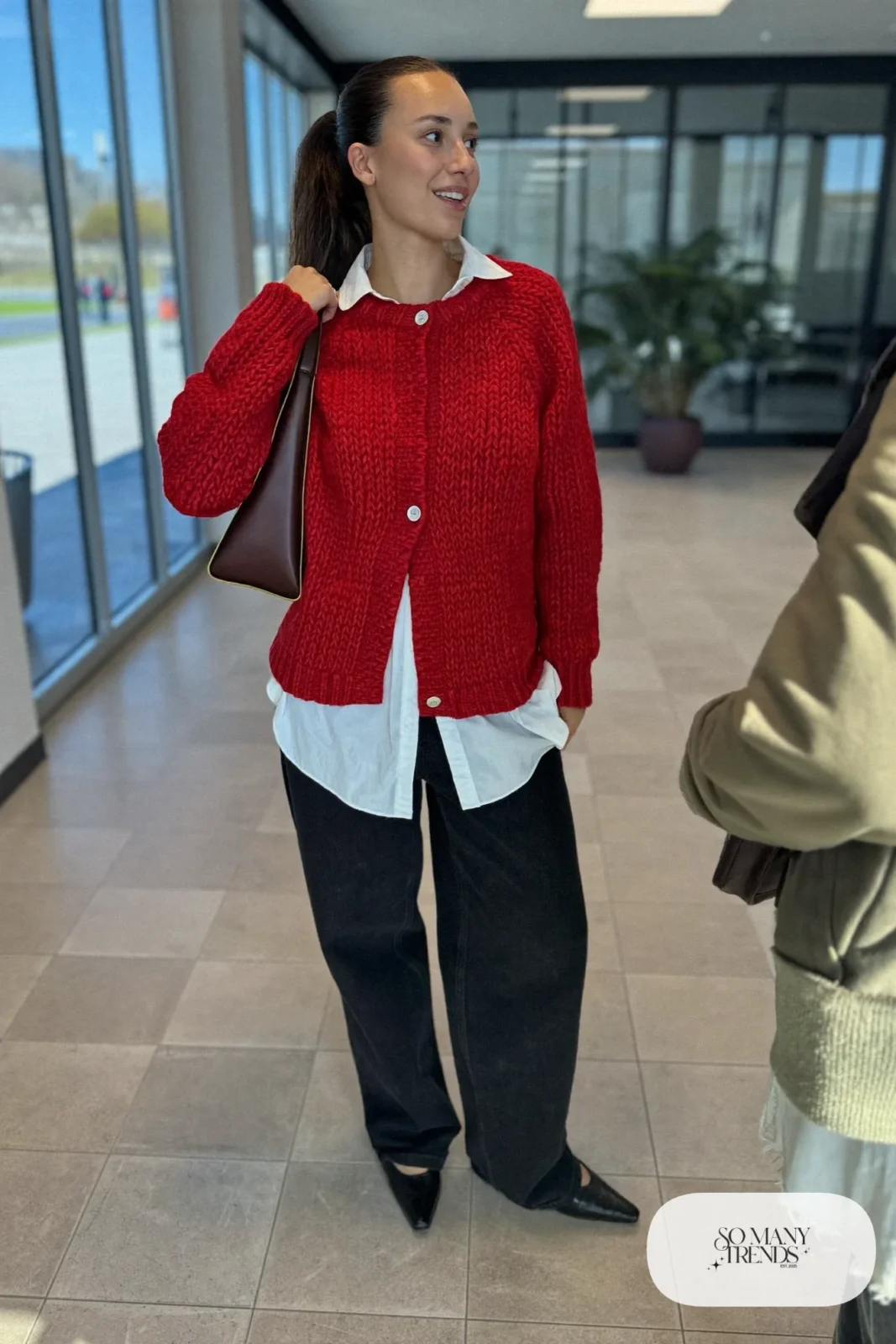 cherry red chunky cardigan, white poplin shirt, black wide-leg jeans, black pointed flats, brown crossbody bag outfit 3