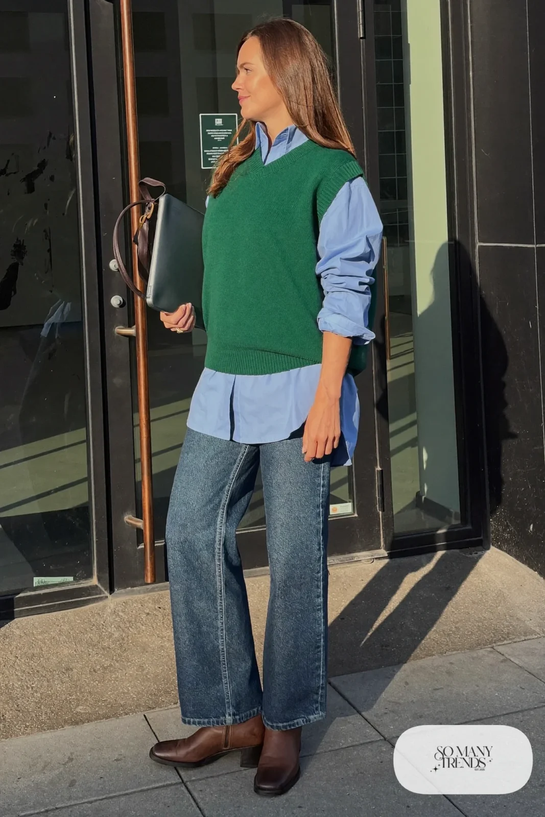 forest green knit vest, light blue oxford shirt, rinsed indigo barrel jeans, brown leather block-heel boots outfit 4