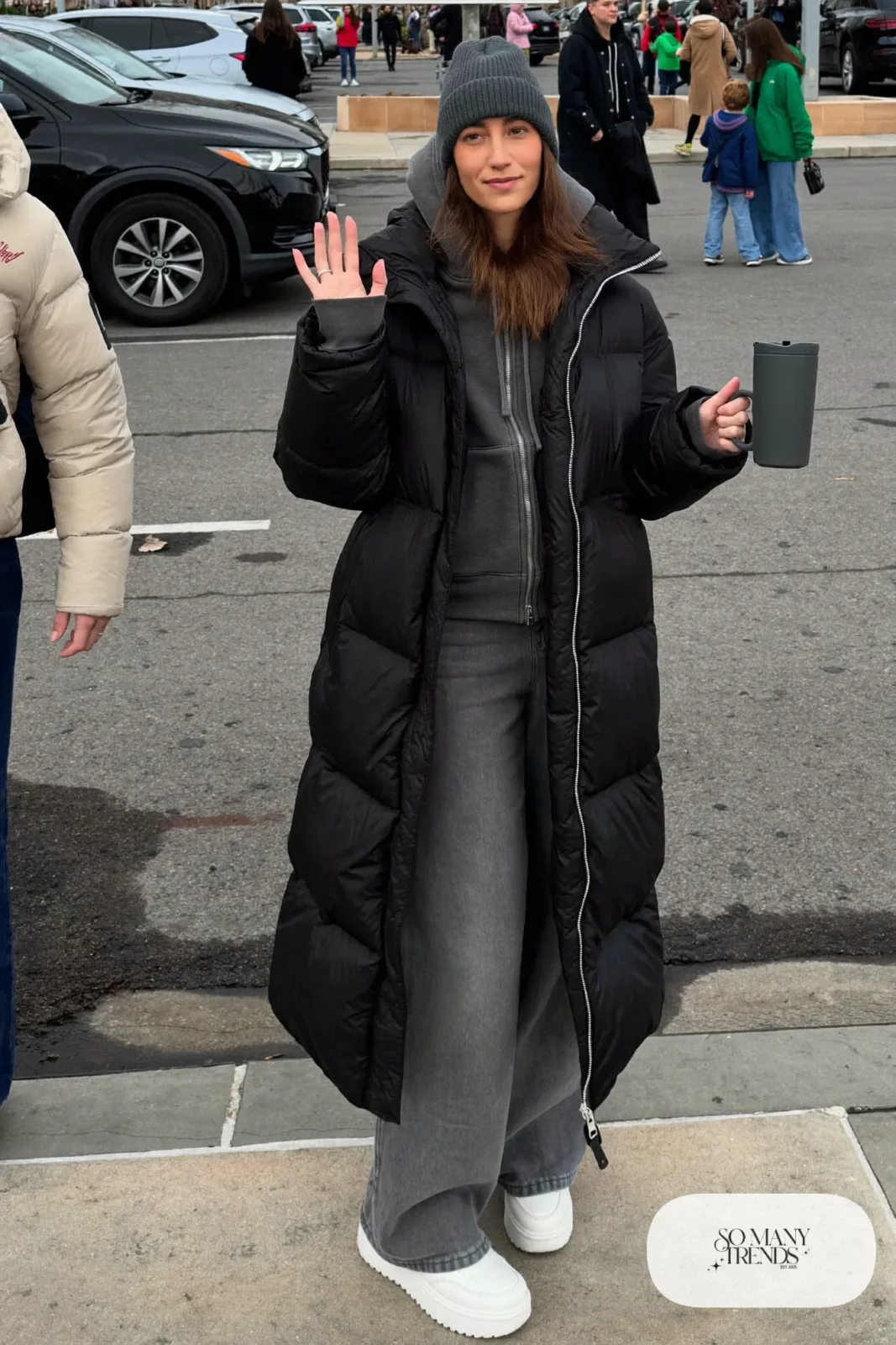 long black puffer coat, charcoal hoodie, gray straight jeans, white leather sneakers, beanie outfit 8