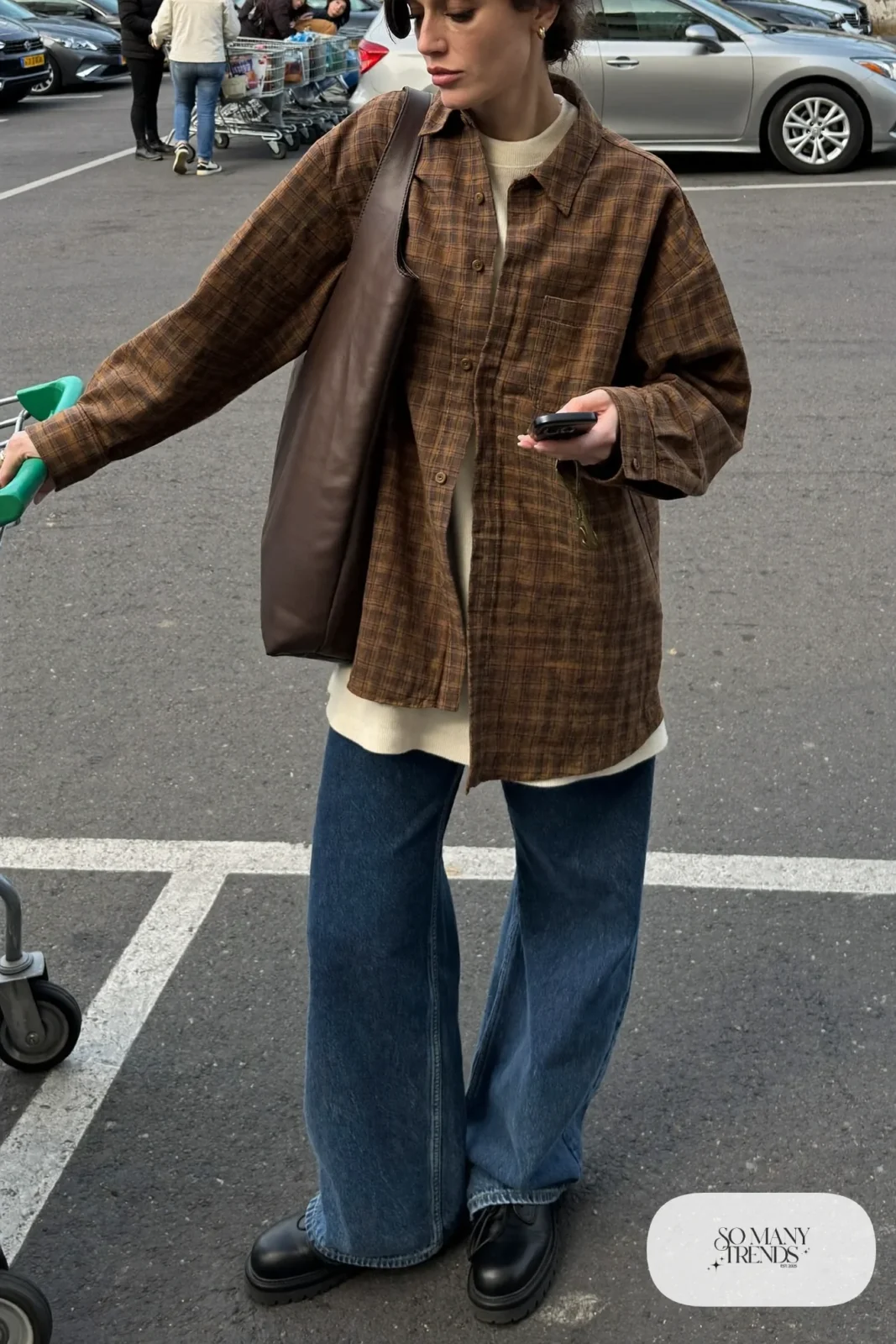 rust plaid flannel shirt jacket, cream thermal top, dark wide-leg jeans, black lace-up leather boots, tote bag outfit 10