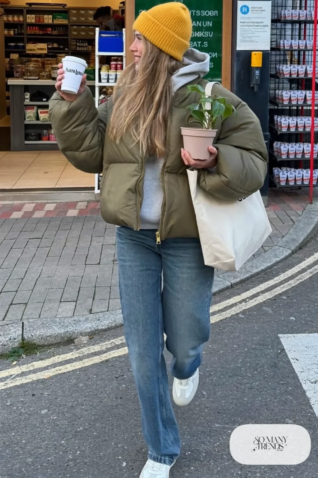 olive quilted jacket, mustard beanie, gray hoodie, medium-wash straight jeans, white sneakers, tote bag outfit 12