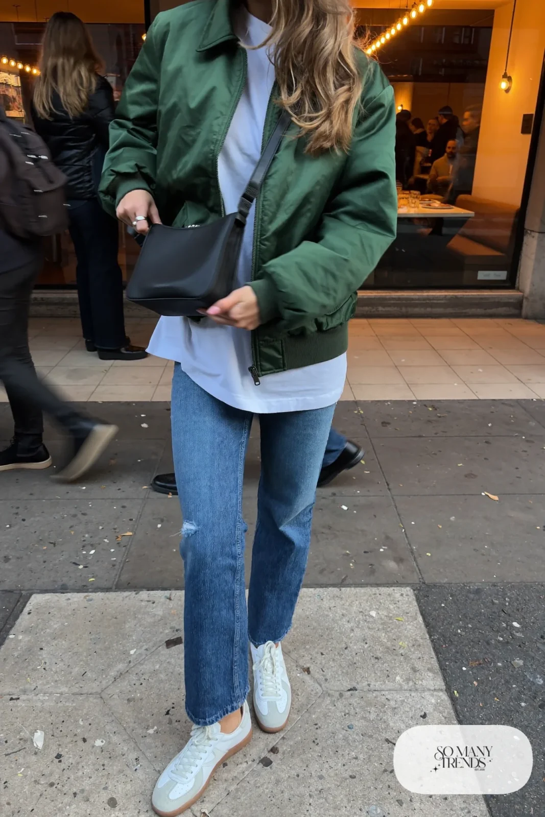 forest green satin bomber jacket, white tee, medium-wash straight jeans, white leather sneakers, mini bag outfit 20