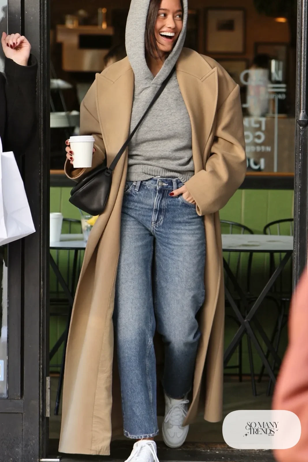 gray heavyweight hoodie, long camel coat, straight medium-wash jeans, white sneakers, crossbody bag outfit 24