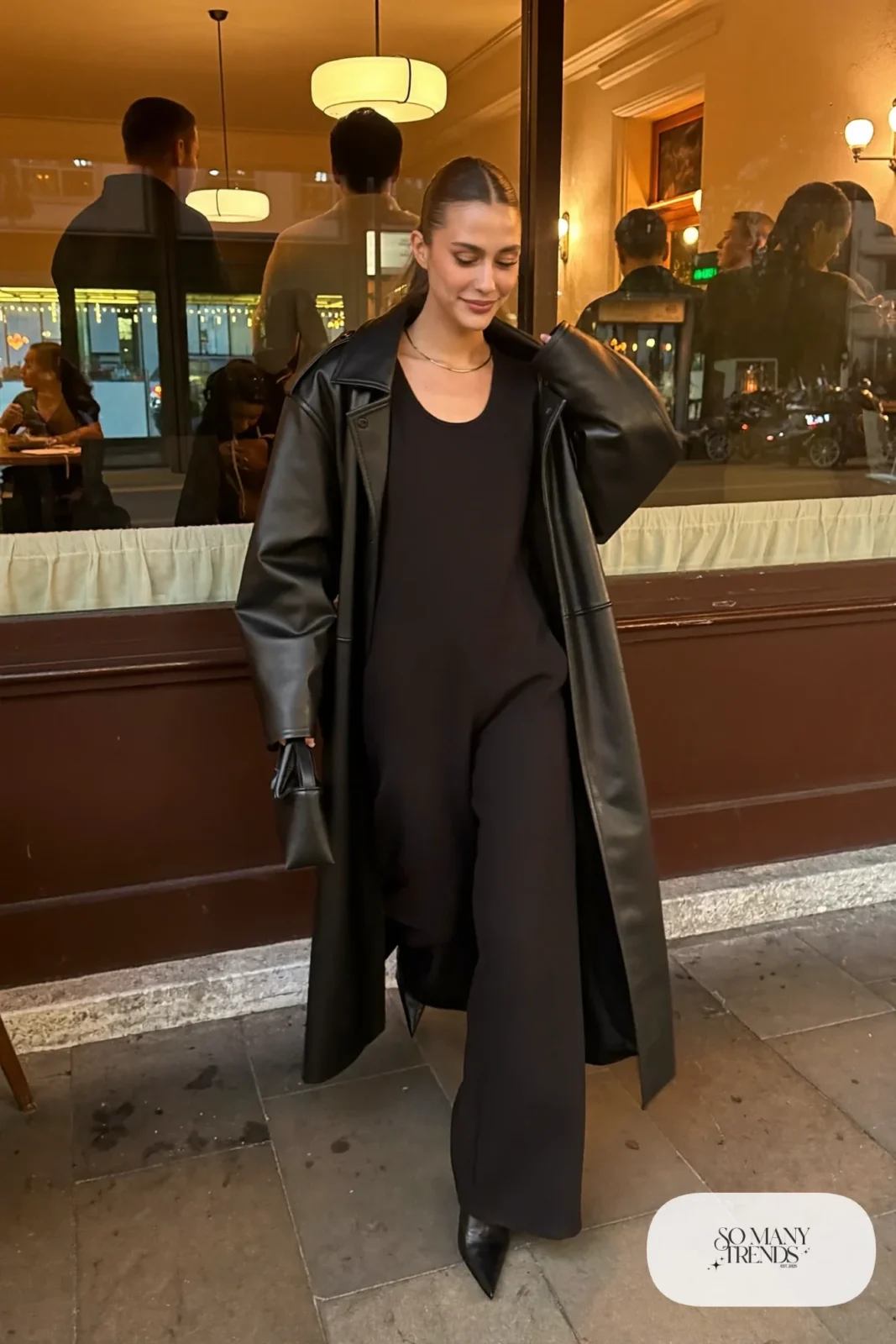 black long sleeve wide-leg jumpsuit black faux leather long coat pointed black boots small bag outfit 11