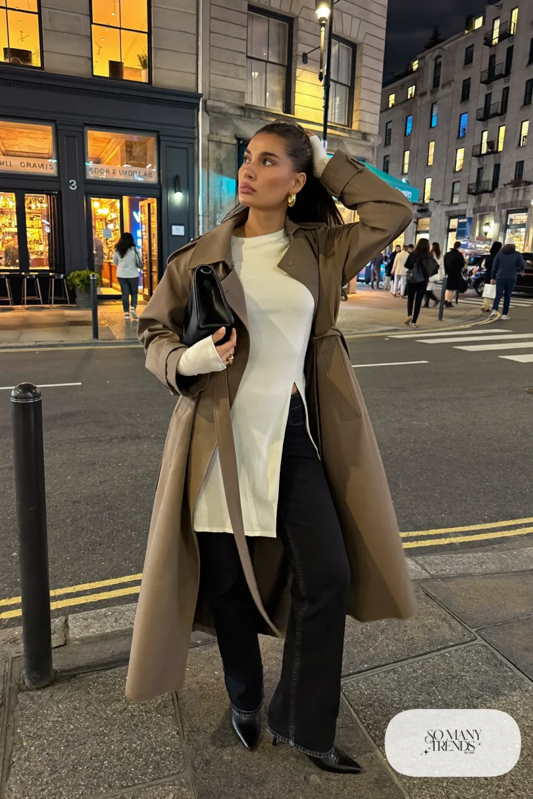 black barrel leg jeans fitted ivory top long stone trench coat pointed black boots small bag outfit 19