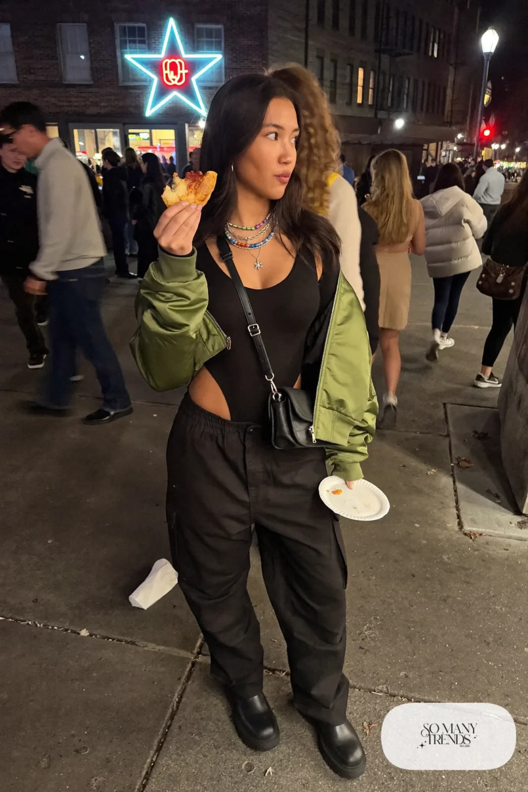 black cargo pants black bodysuit olive satin bomber jacket chunky boots small bag silver jewelry outfit 23