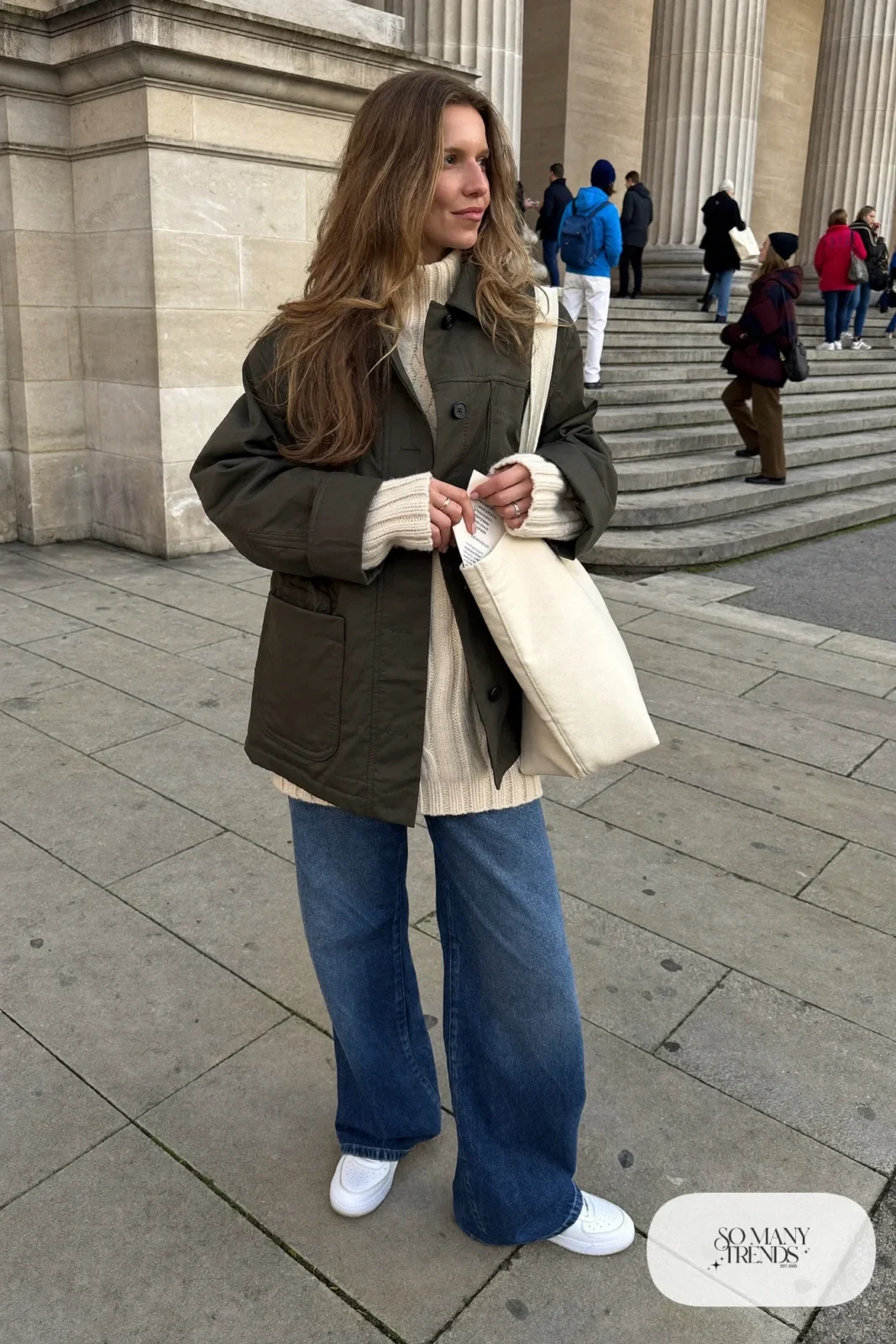 olive waxed cotton jacket cream cable knit sweater wide-leg jeans white leather sneakers outfit 9